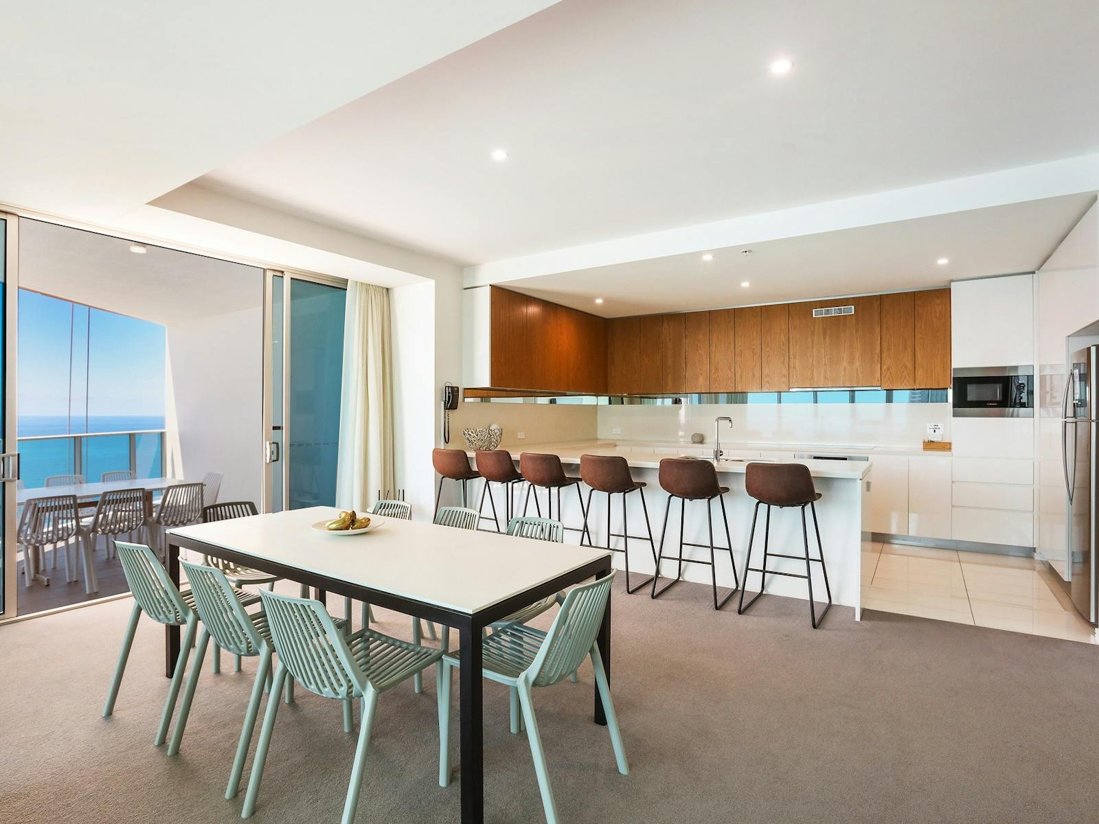 Kitchen and dining area with open plan living and ocean views at the Hilton Surfers Paradise Kitchen and dining area with open plan living and ocean views at the Hilton Surfers Paradise