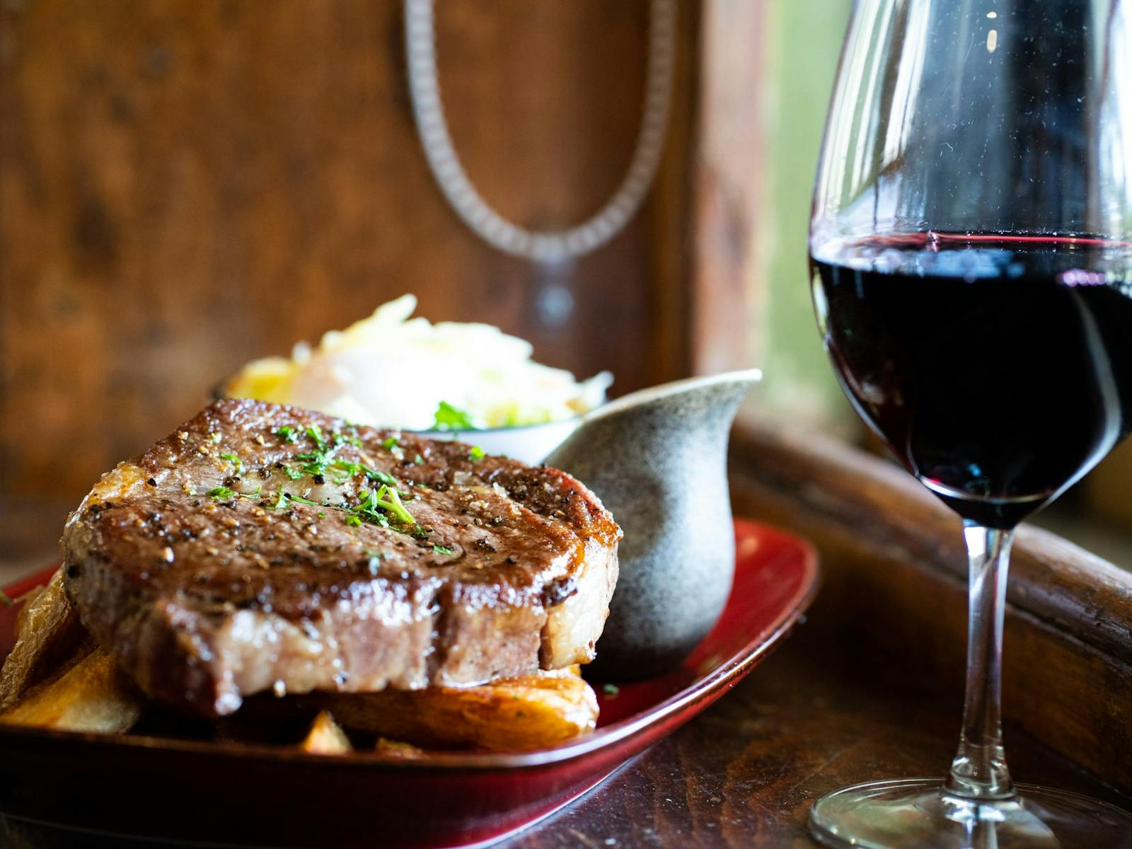 Steak served with mash potate and glass of Clare Valley red wine