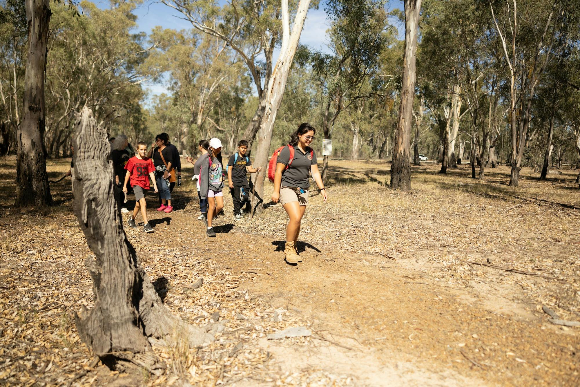 Group walking the Yamyabuc Trail in the Dharnya Precinct with a Knowledge Holder.