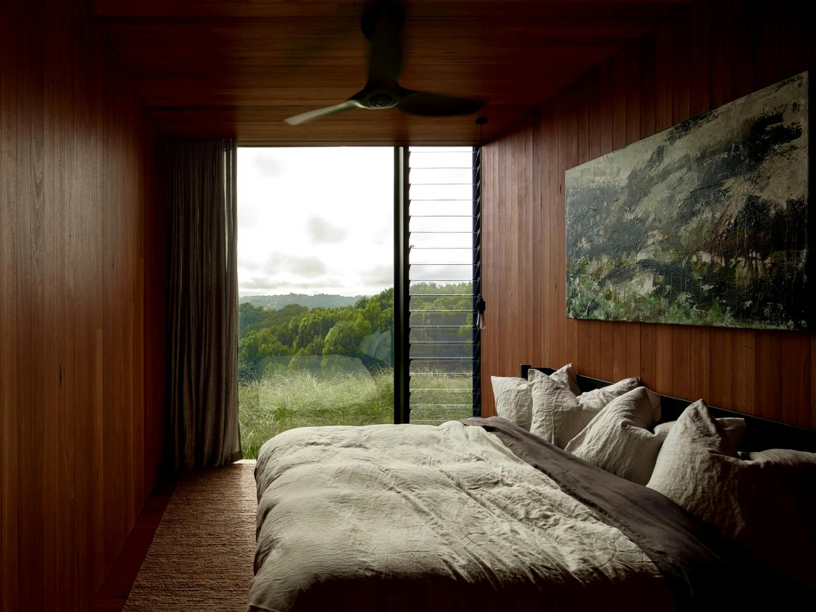 Master suite featuring an ensuite with a bathtub, a large walk-in robe and private deck with views