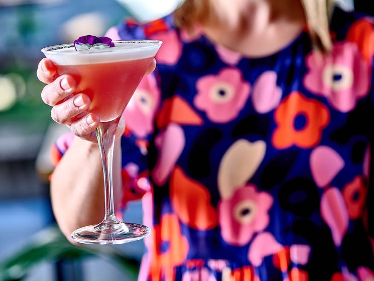 Lady holding a cocktail