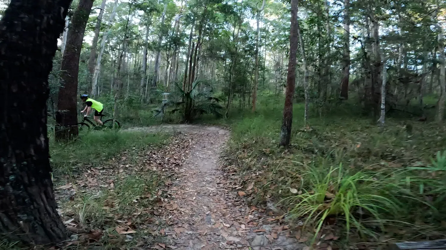 Riding a switchback  onParklands MTB trail