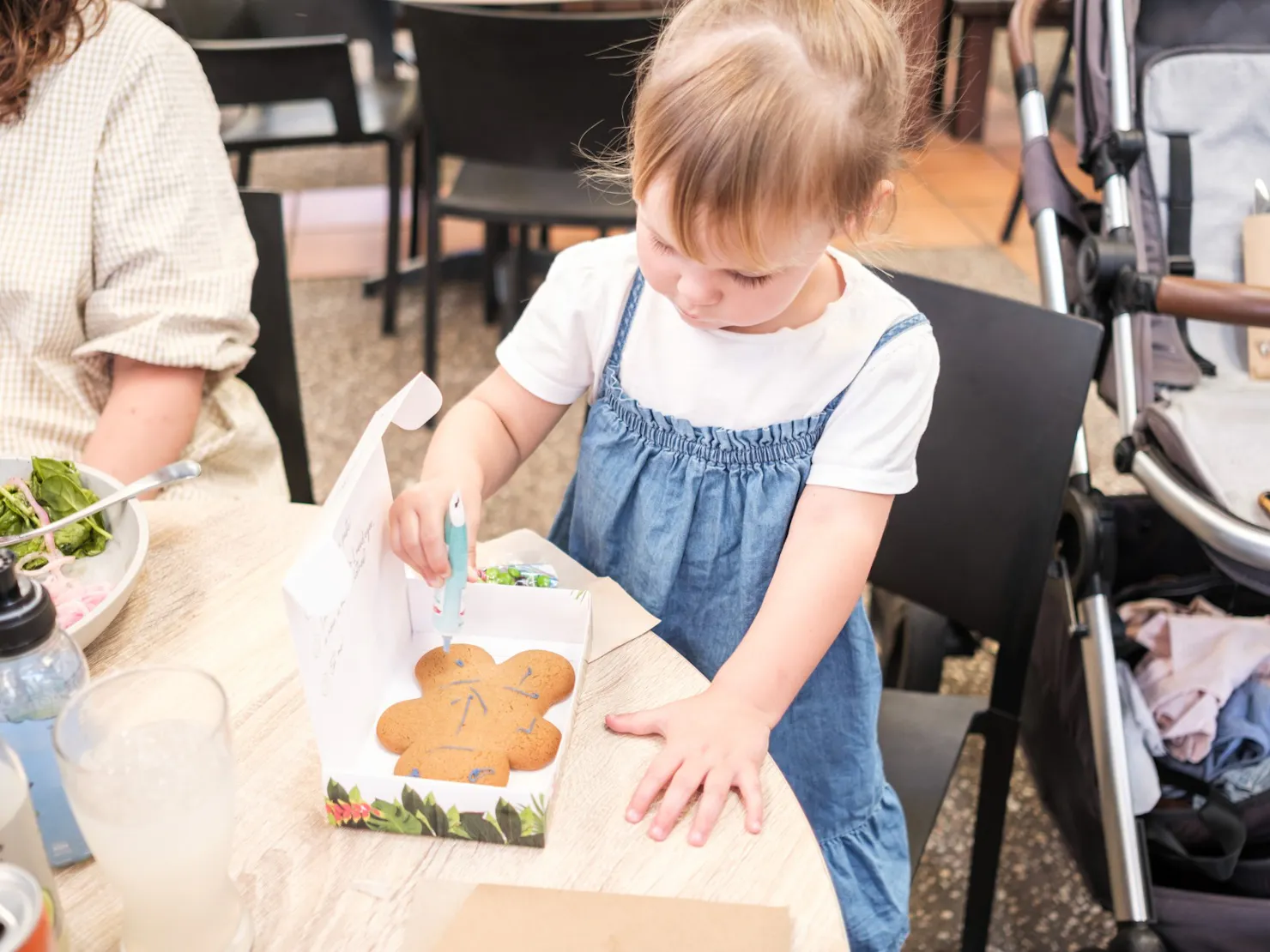 A young child making a gingerbread