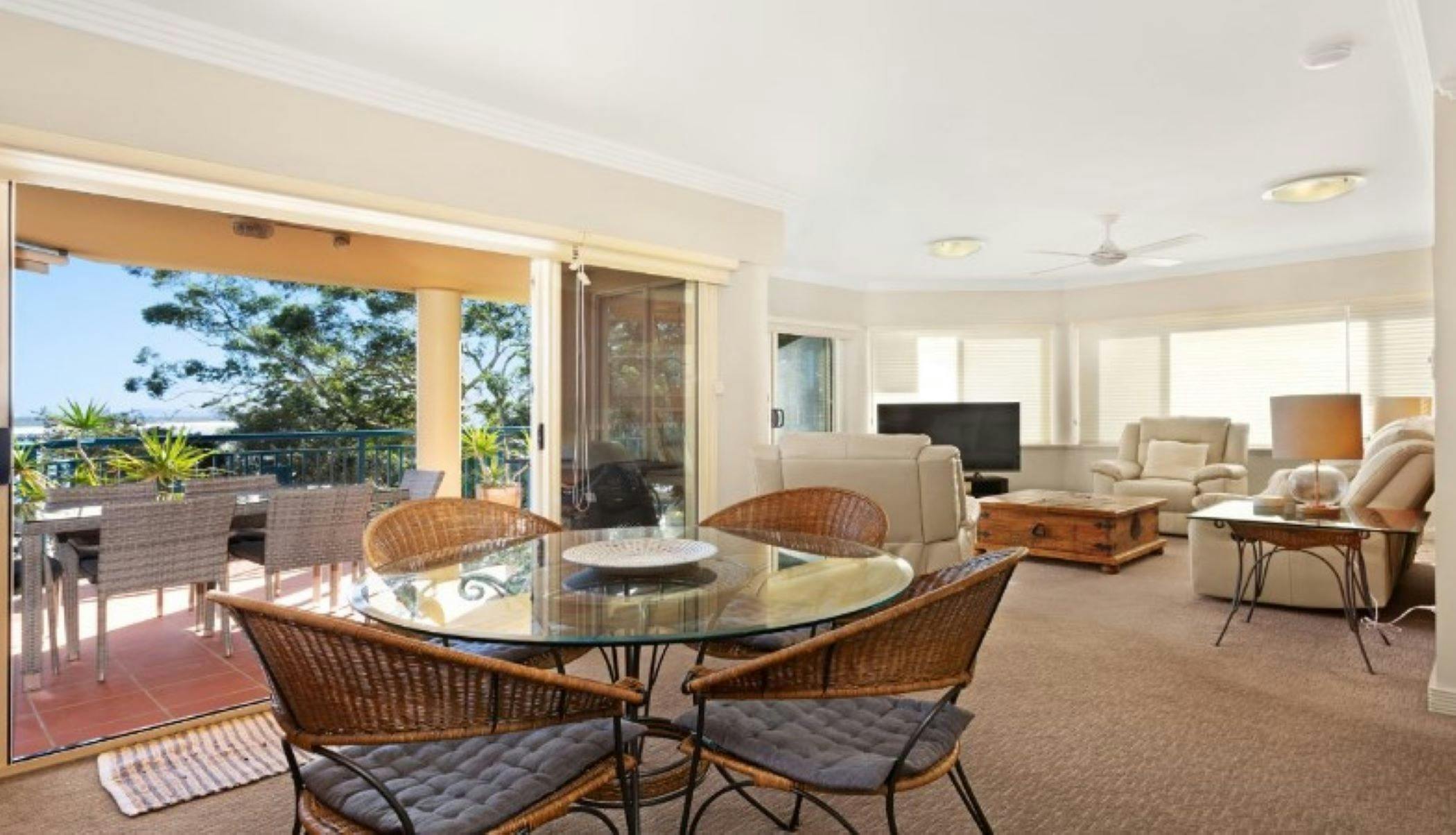 Living and dining leading on to balcony with ocean views