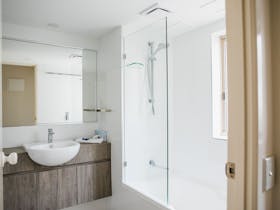shower in the bathroom in a 1 Bedroom Ocean View Apartment