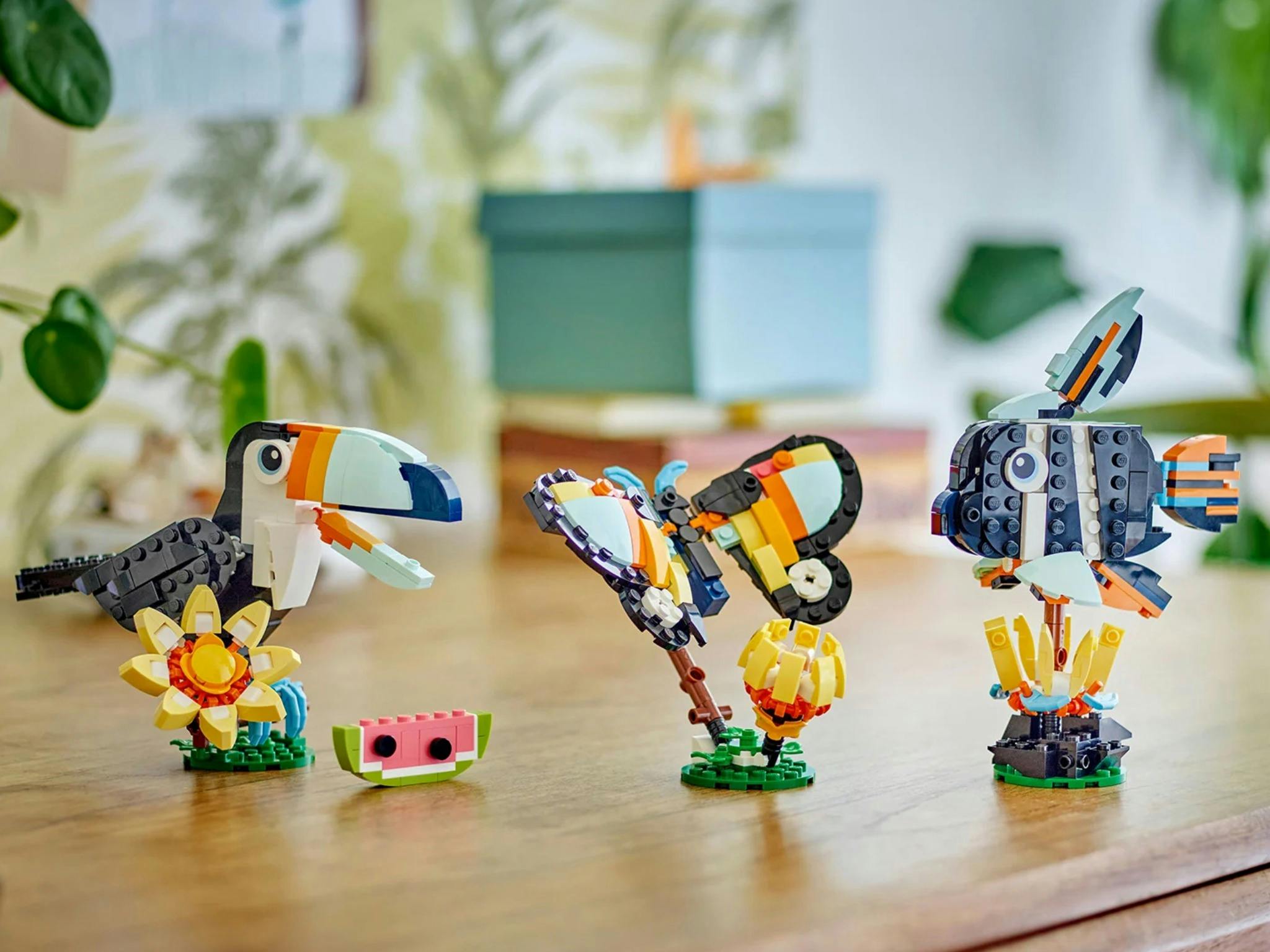 Lego toucan, butterfly and fish on table