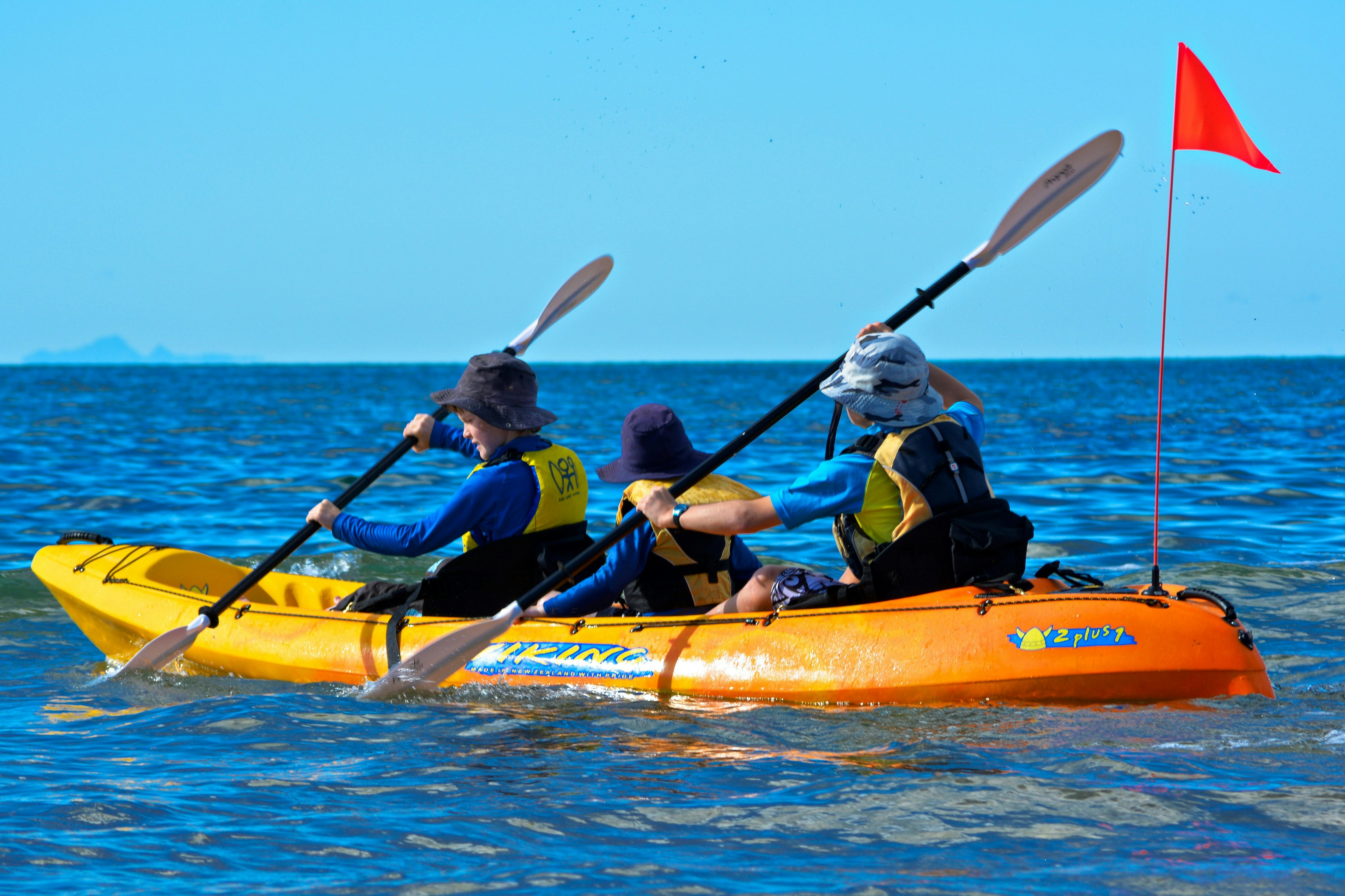 Three kids kayaking