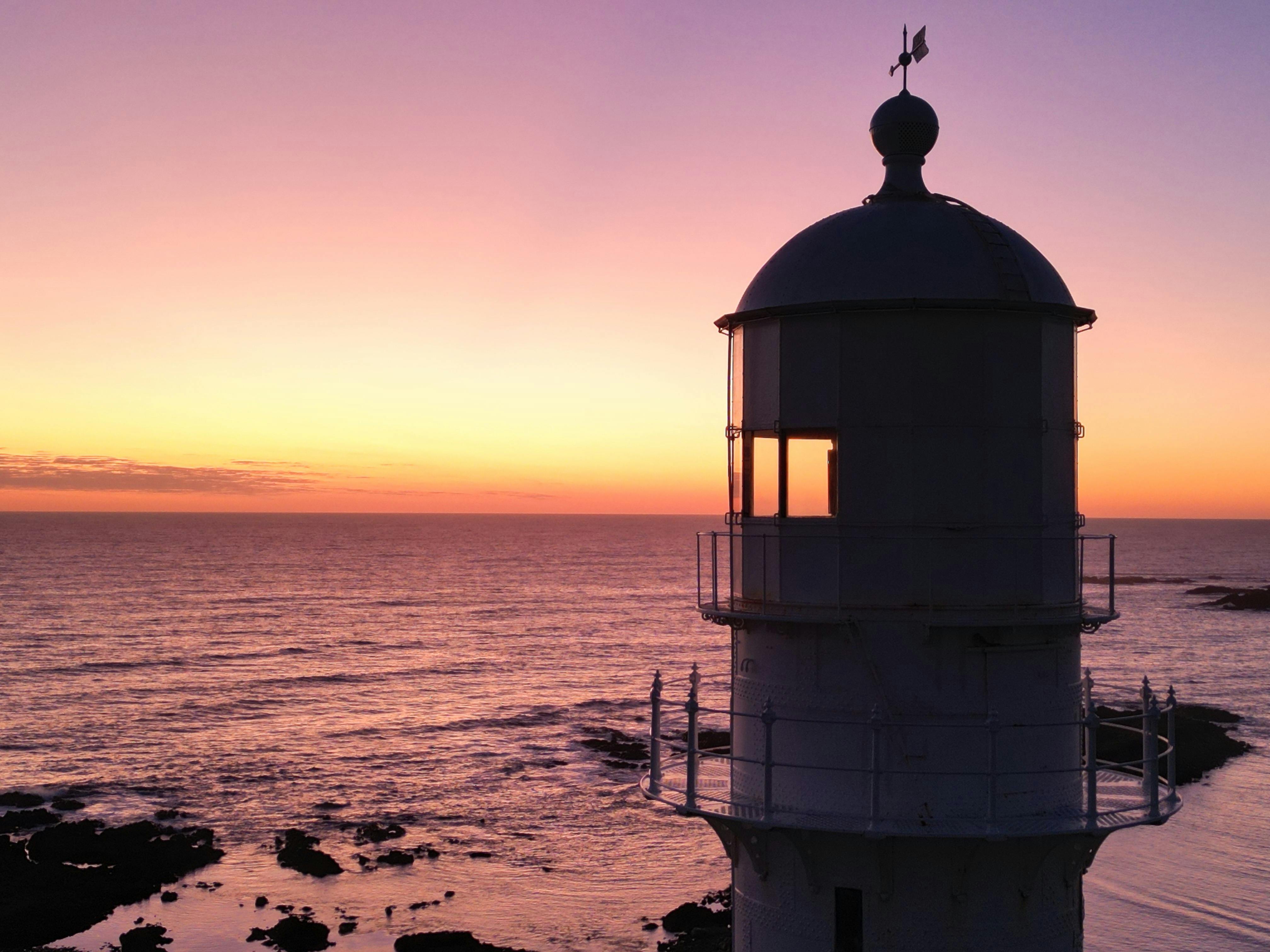 View of Currie Lighthouse with the setting sun in the background