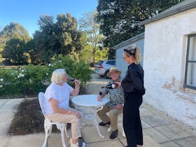 Drinks outside cottage