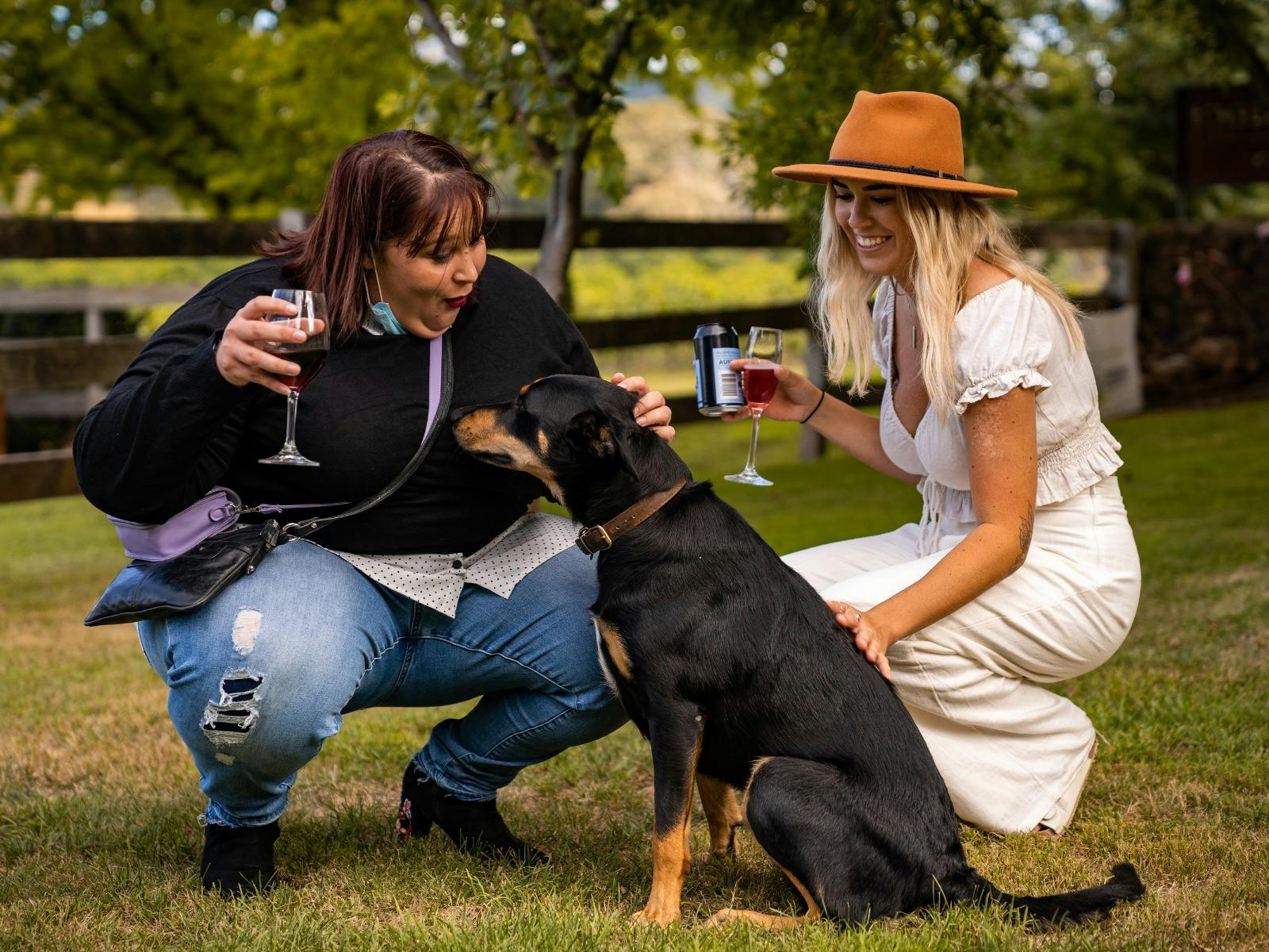 Girls patting dog with wine at Stockman's Ridge Wines