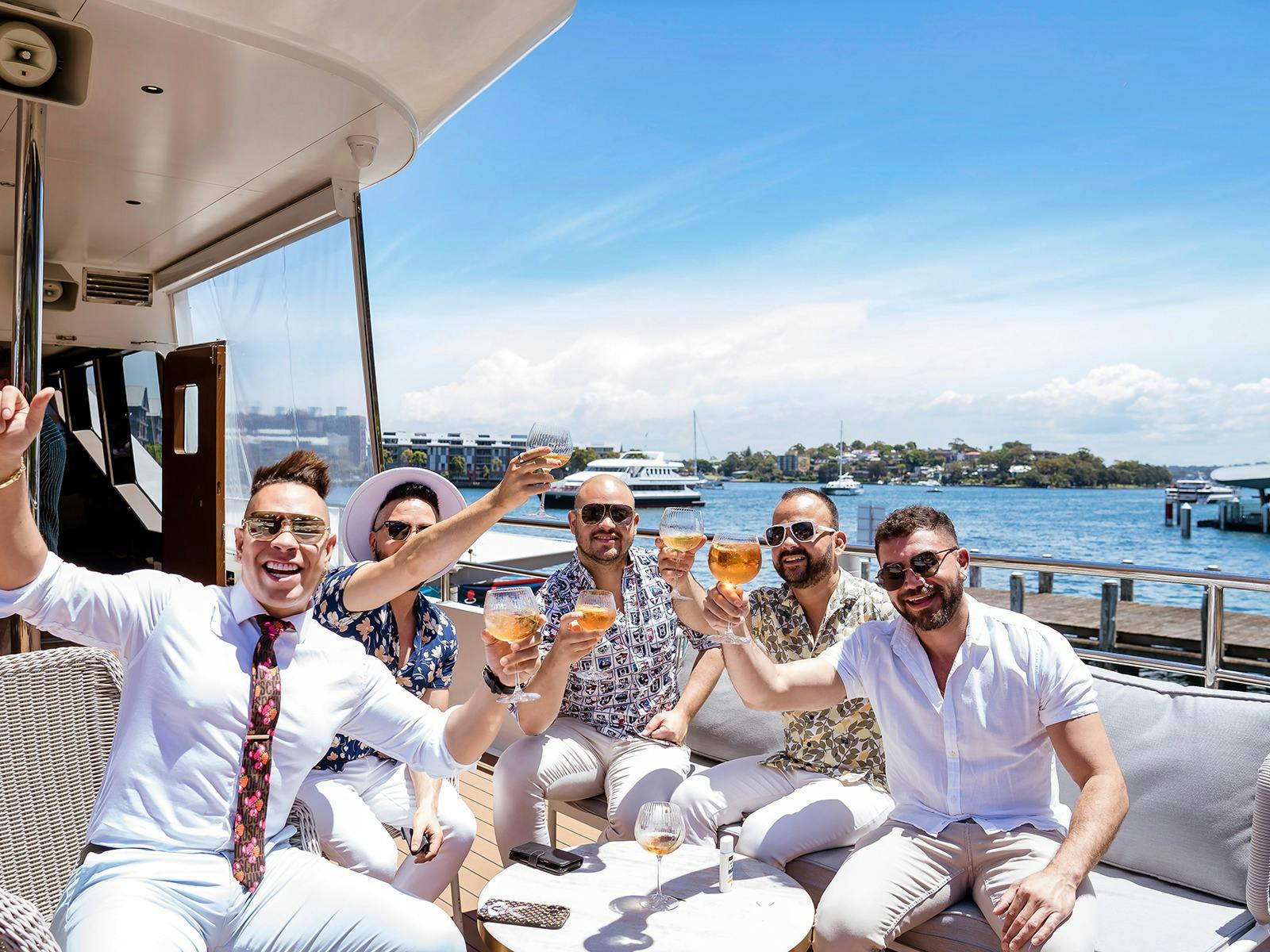 Group on Sydney Harbour in sun enjoying Chandon Long Lunch
