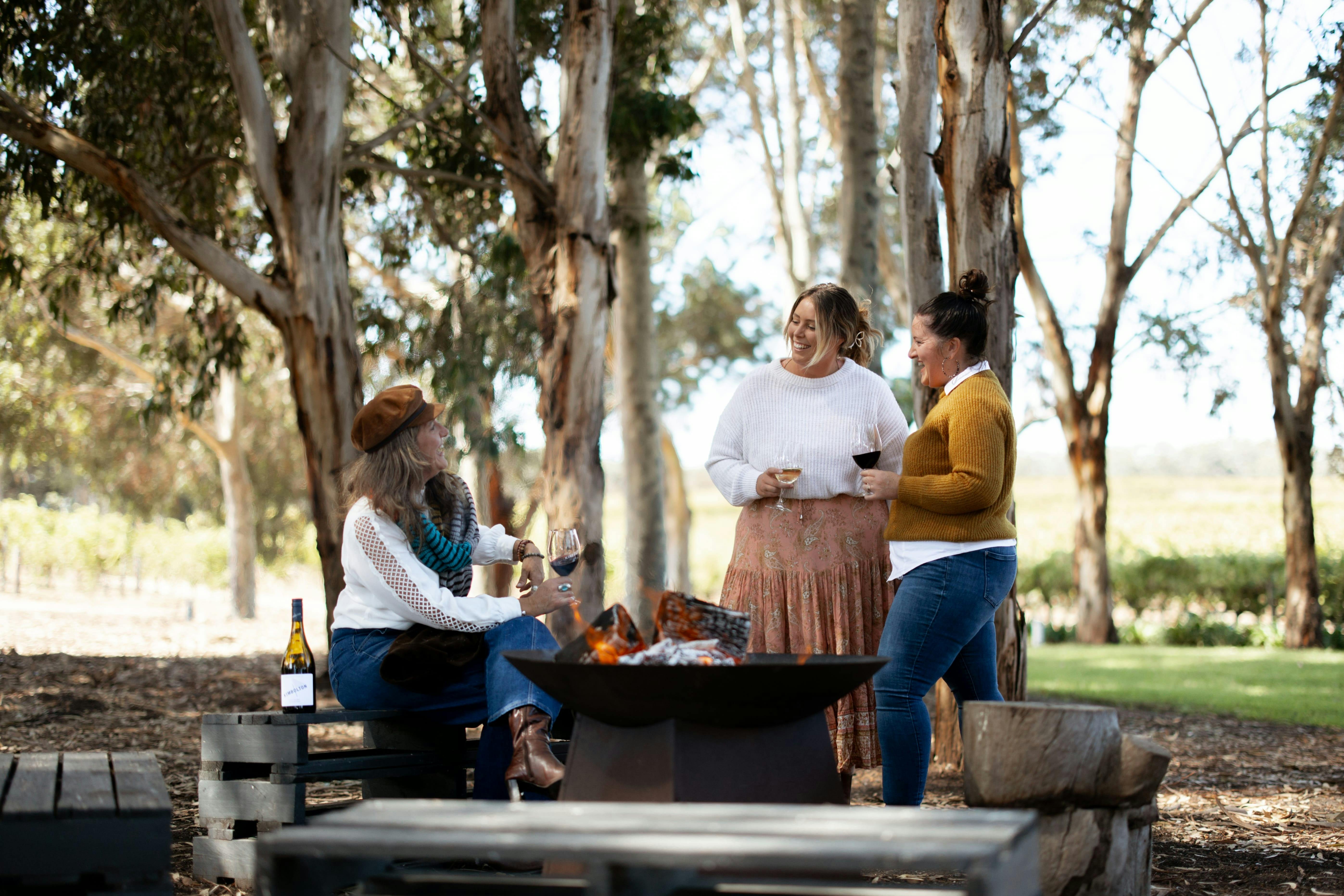 Three Ladies enjoying wine amongst vineyards and gumtrees in Fleurieu Peninsula