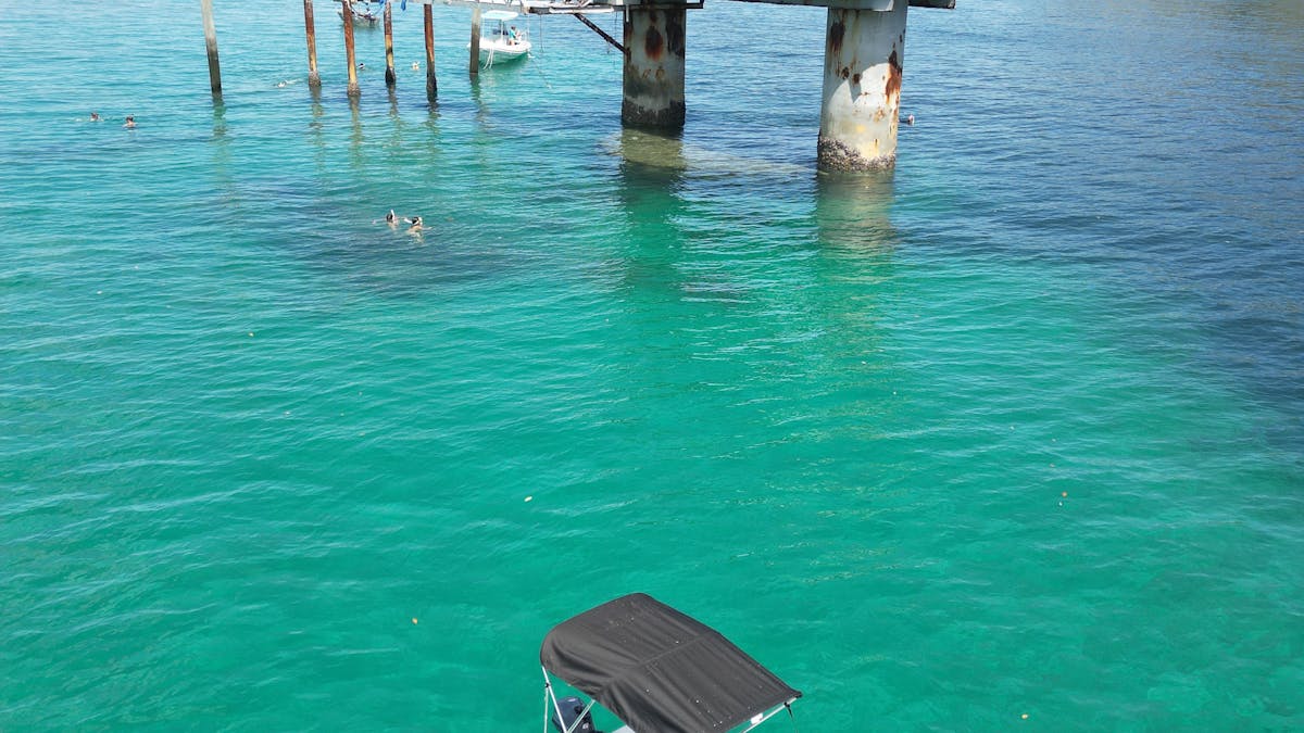 White canopy hire boat near the old pier at Great Keppel Island, QLD