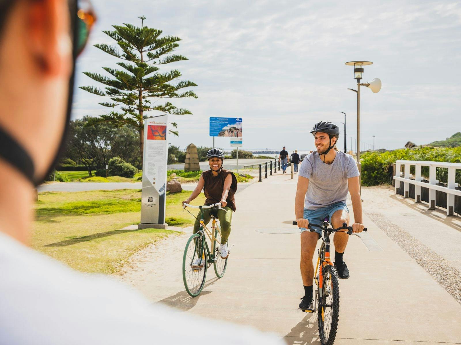 Guests bright-eyed with smiling faces enjoying a Newy Rides tour