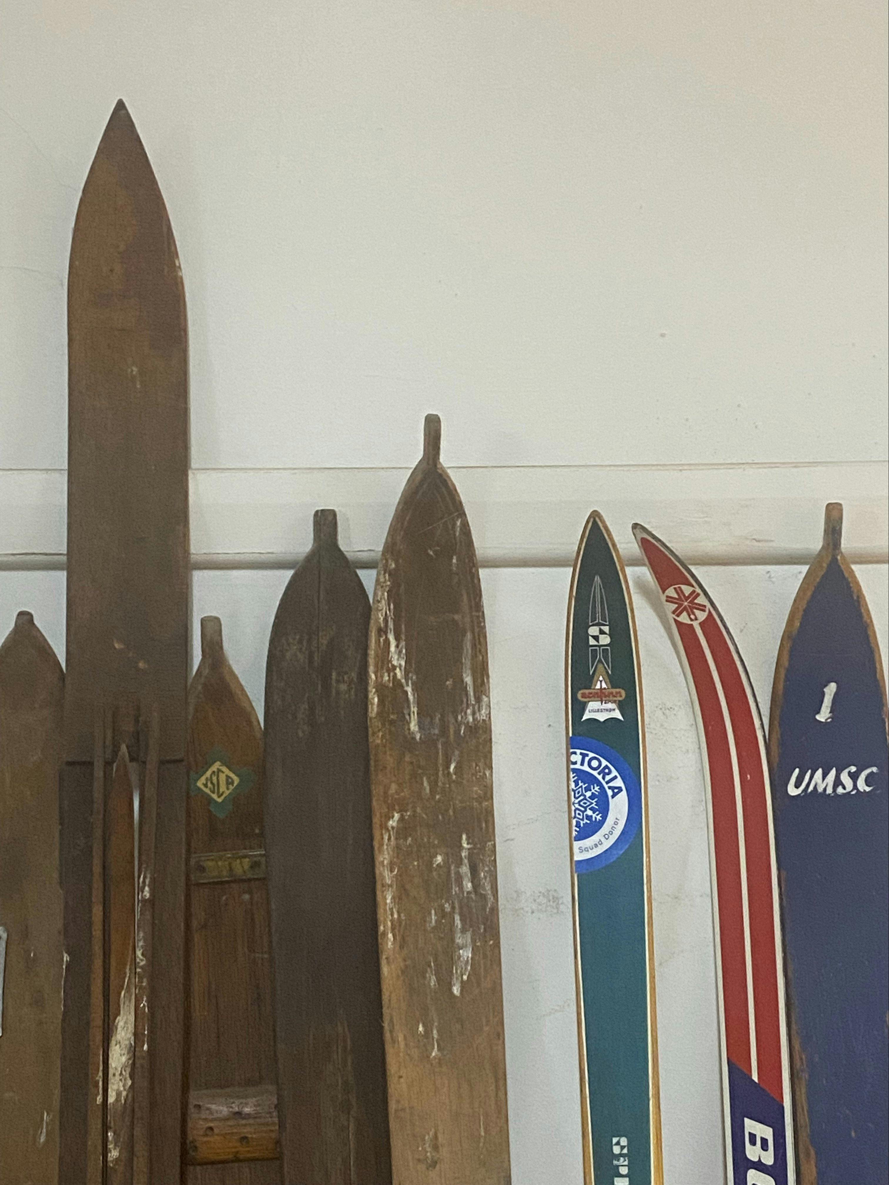 The tops of antique wooden skis