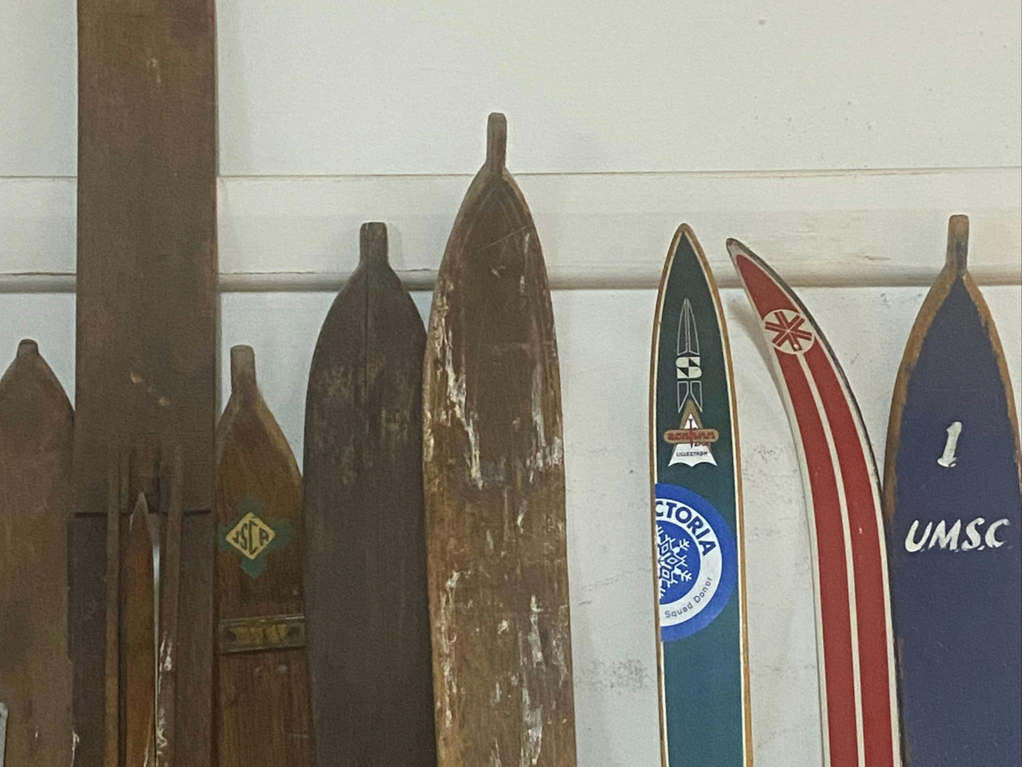 The tops of antique wooden skis