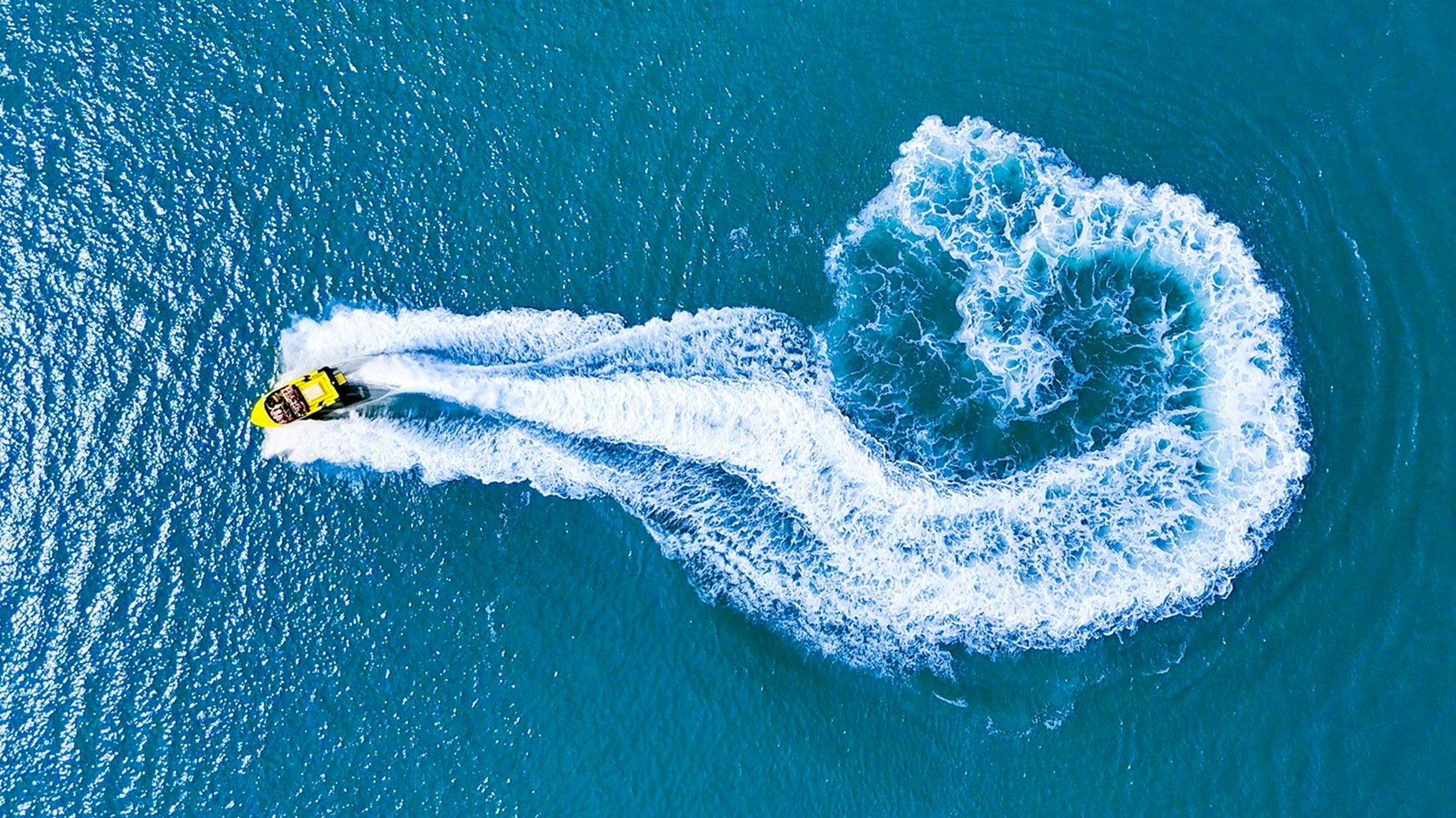 aerial image of jet boat moving at speed