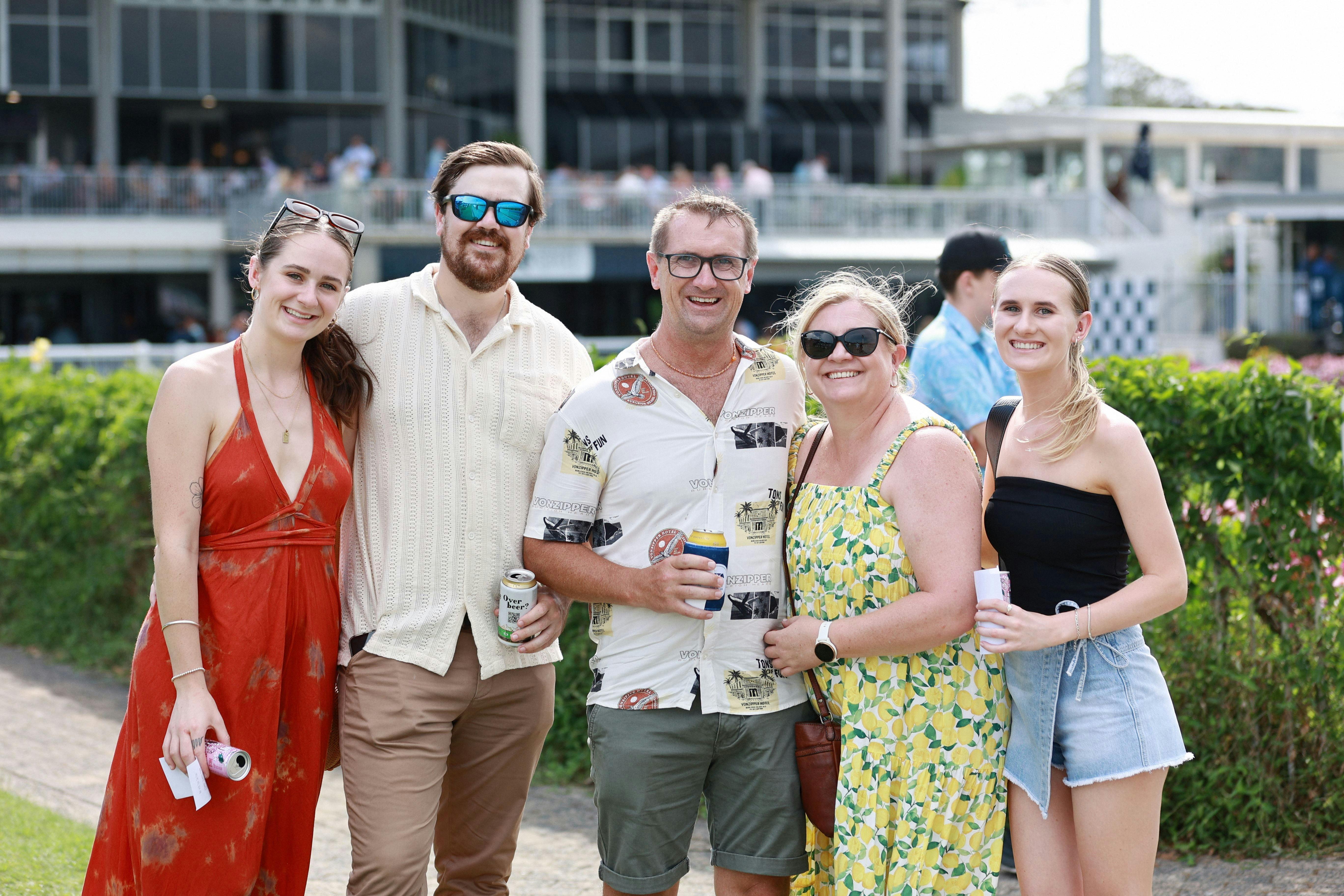 Group of people having their photo taken infront of the mounting yard