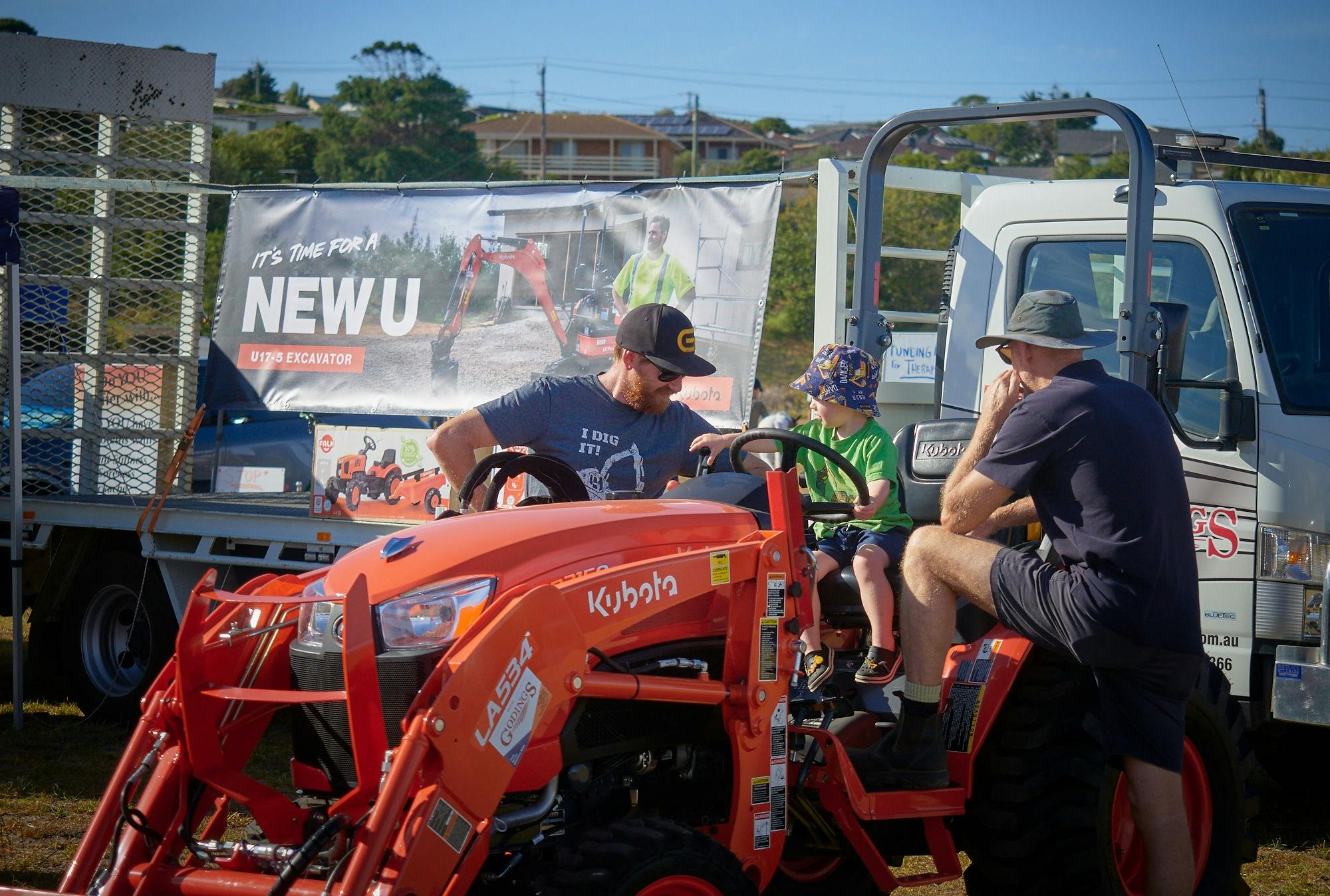 A child exploring farm machinery on a tractor at the Bellarine Agricultural Show.