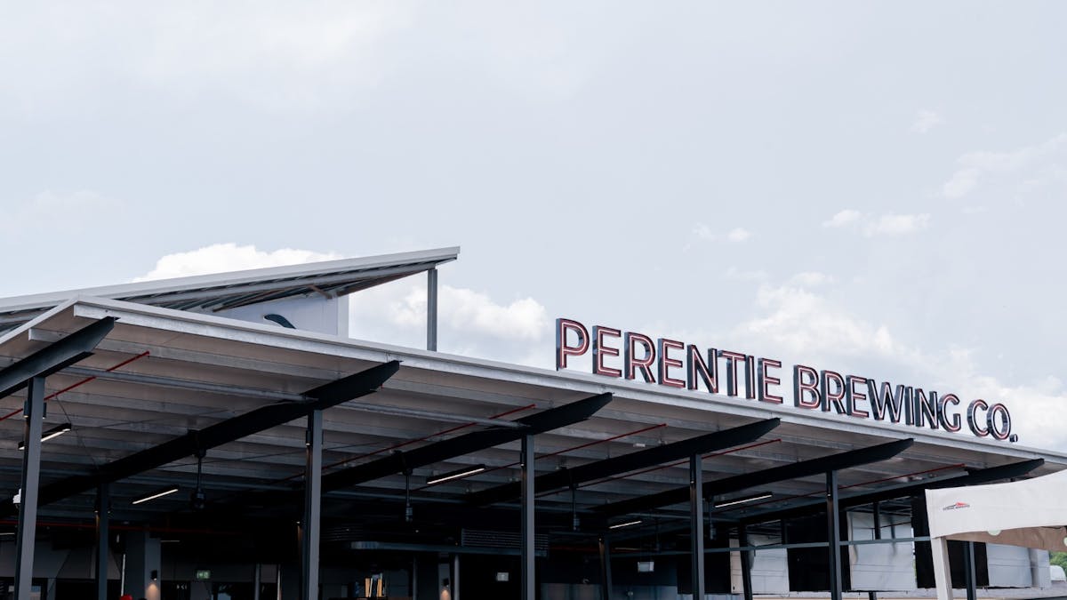 Looking from the carpark onto the outdoor covered beer garden