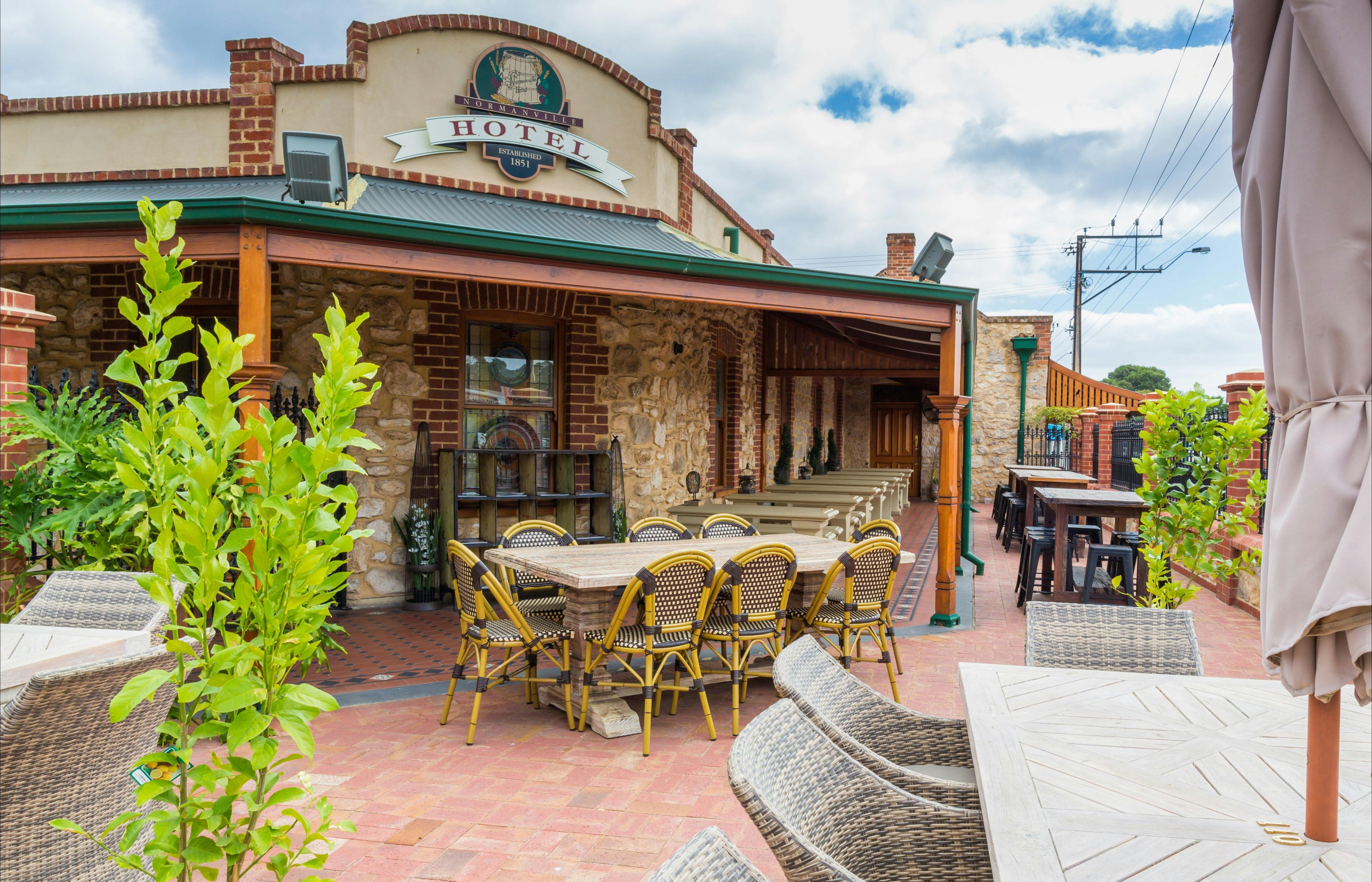 Seating in Beer Garden, Normanville Hotel with hotel building in background. Photo taken in 2014.