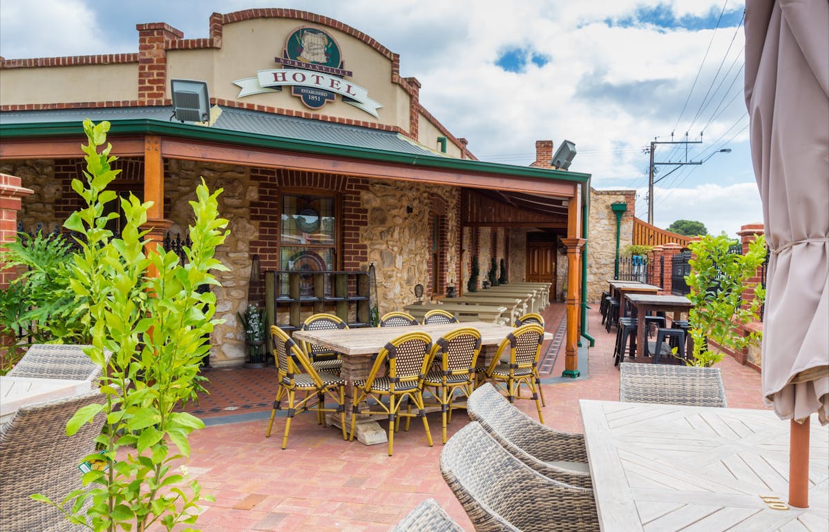 Seating in Beer Garden, Normanville Hotel with hotel building in background. Photo taken in 2014.