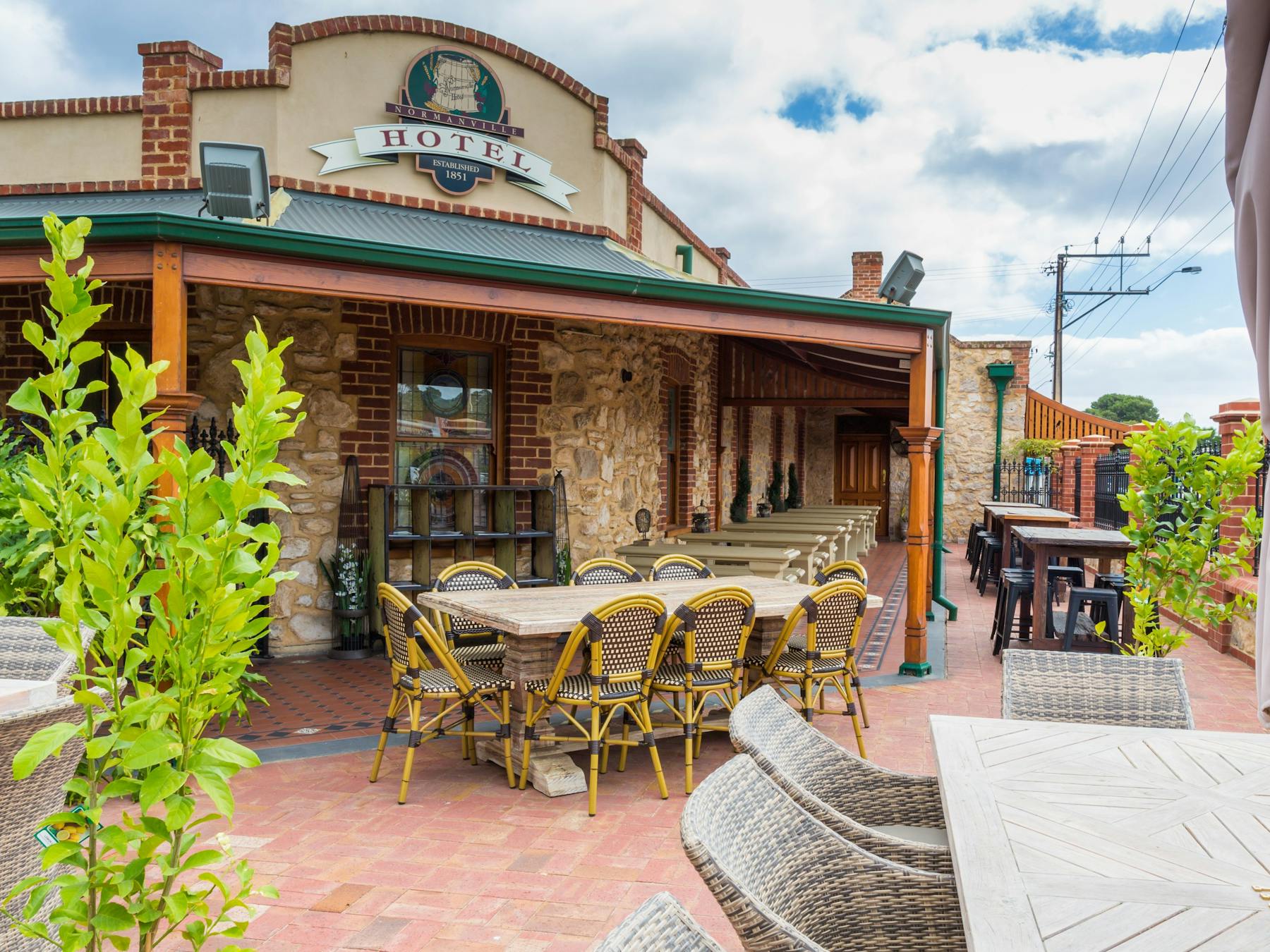 Seating in Beer Garden, Normanville Hotel with hotel building in background. Photo taken in 2014.