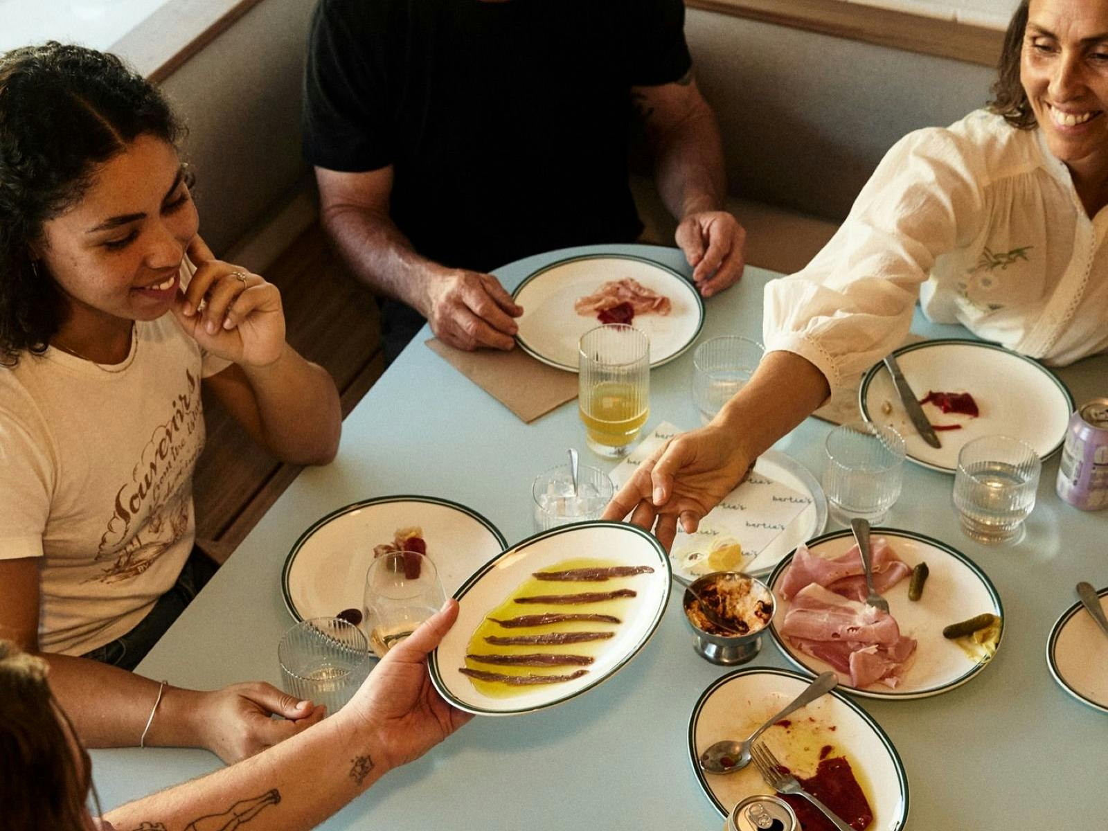 four people dining at Bertie's