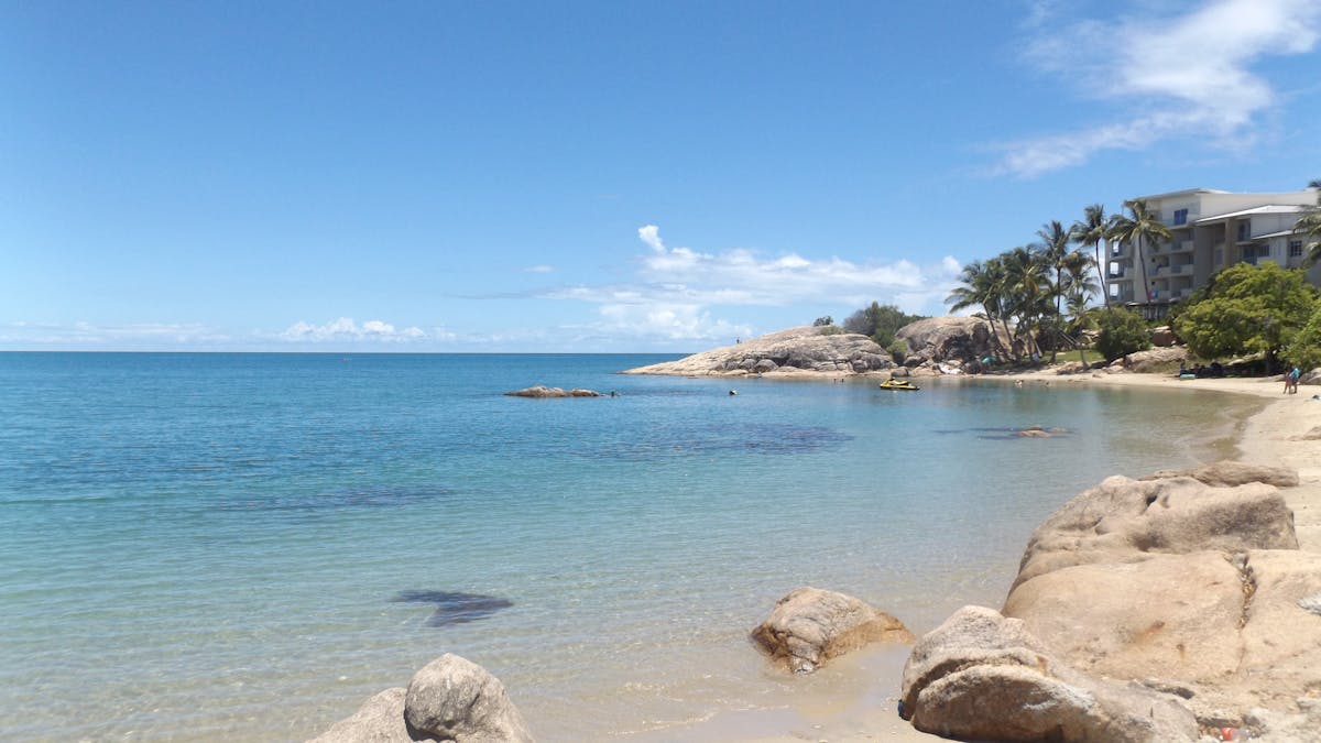 resort accommodation and sunny beach at Grays Bay Bowen