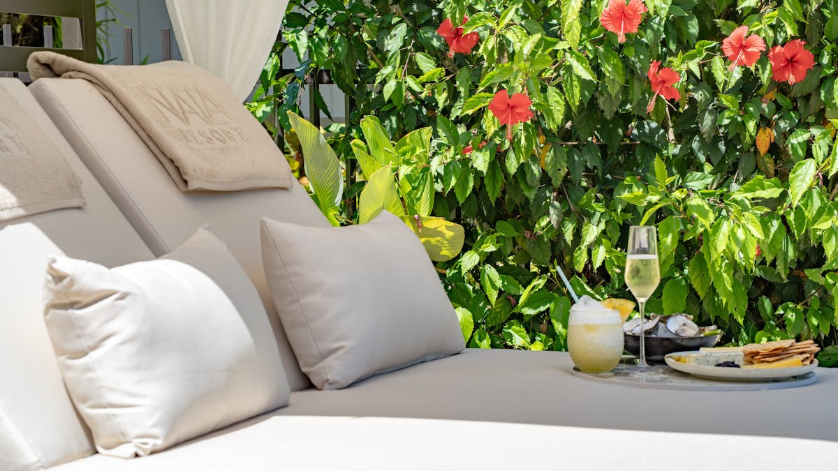 Pool Cabana surrounded by tropical gardens with tro[pical cocktails & fresh seafood