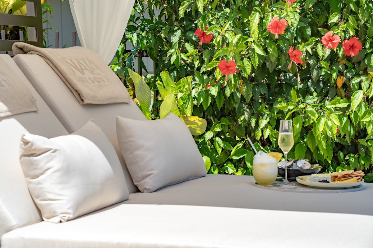 Pool Cabana surrounded by tropical gardens with tro[pical cocktails & fresh seafood