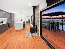 View of farm, sunset with cows and sheep. Showing the indoor outdoor space including the hot tub.