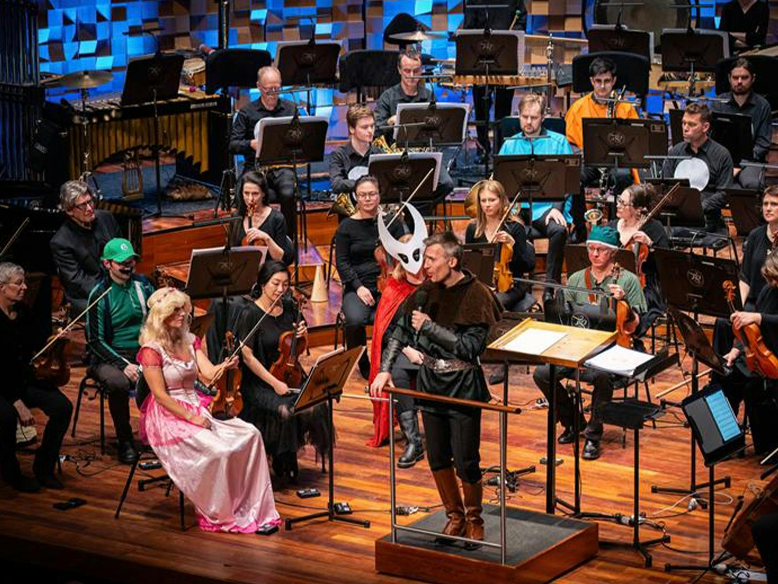 Conductor on stage dressed as a ranger for a gaming music concert