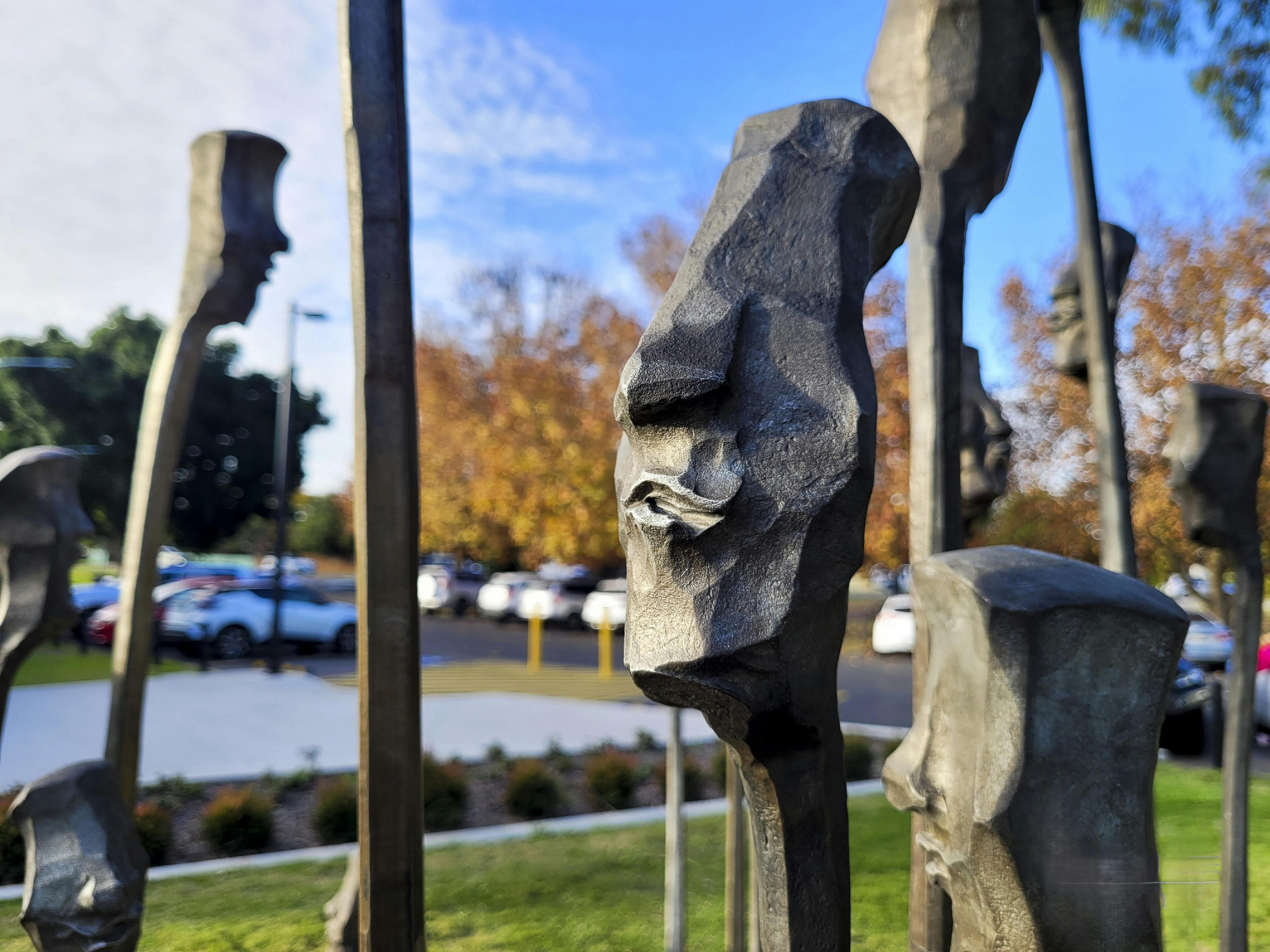 Close up view showing stylised head created from forged alloy steel.