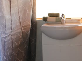Shower and handbasin in the renovated caravan