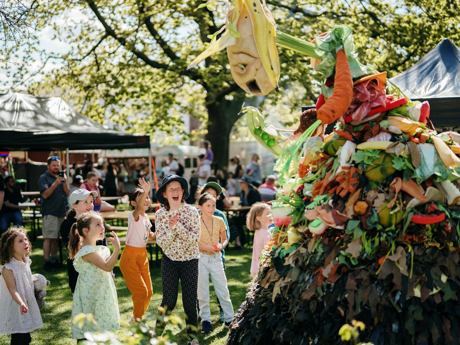 Large material puppet made to look like living compost heap delights young children