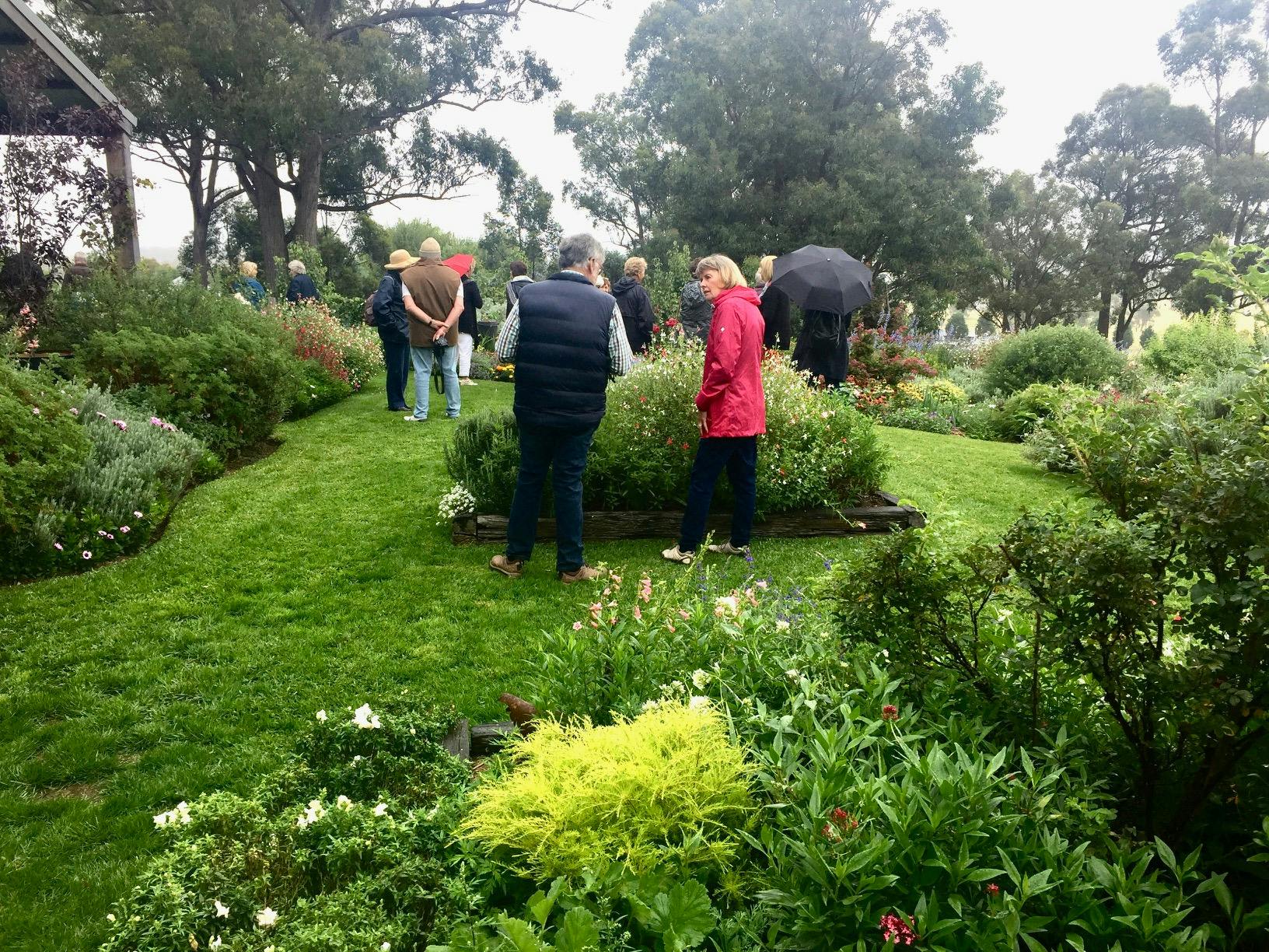 People in the gardens on a misty rainy day