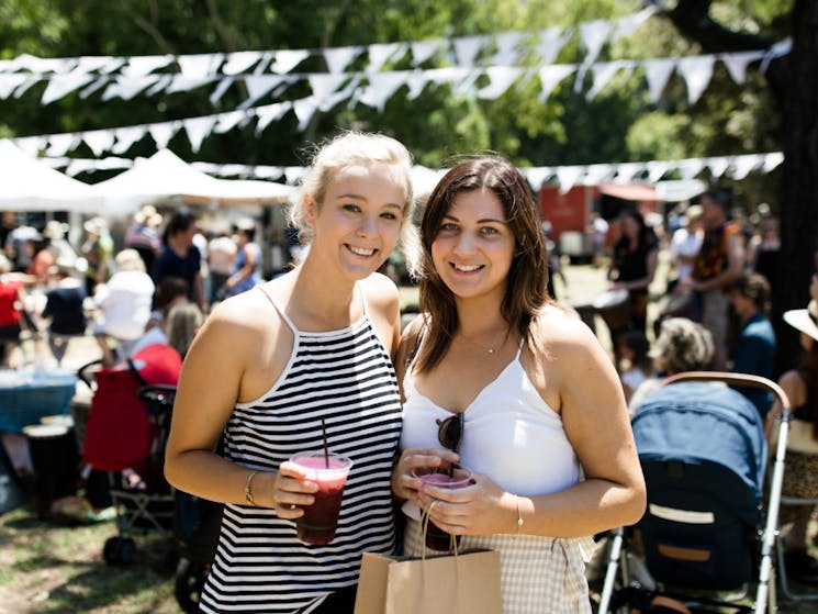 Pick up delicious food & drink from The Olive Tree Market's street food stalls