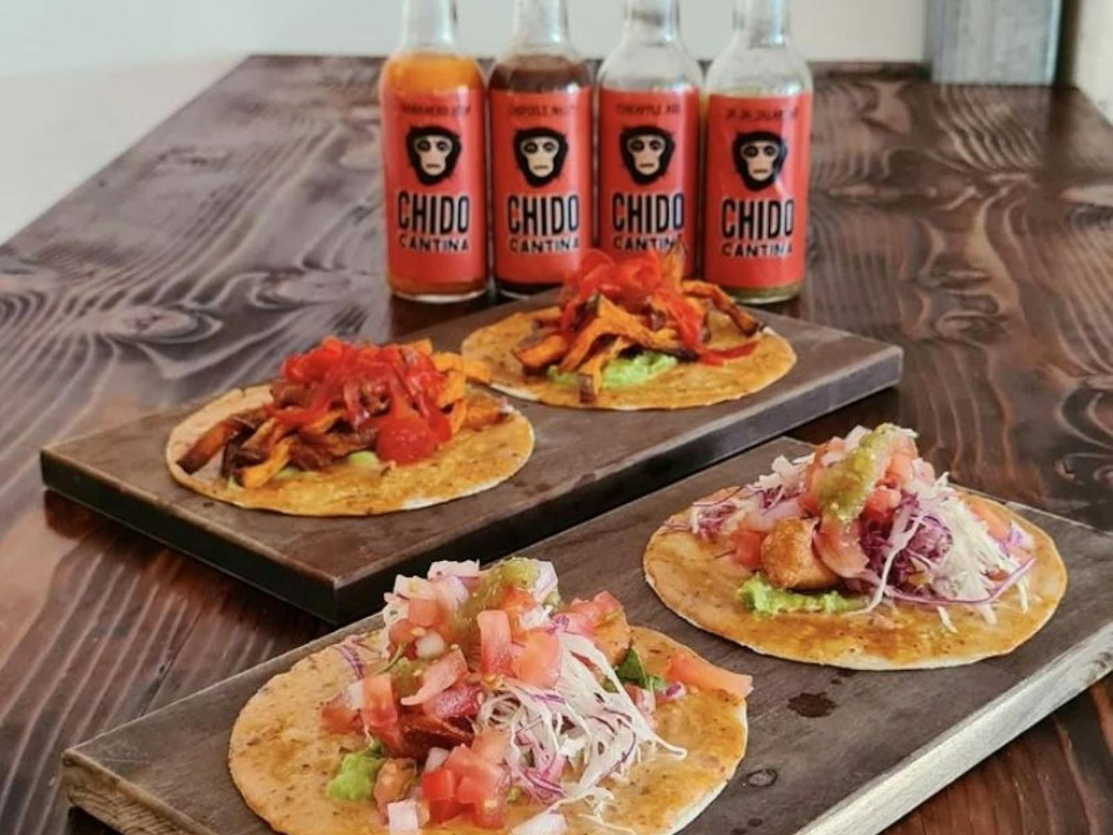 Tablescape of tacos and Chido Cantina drinks