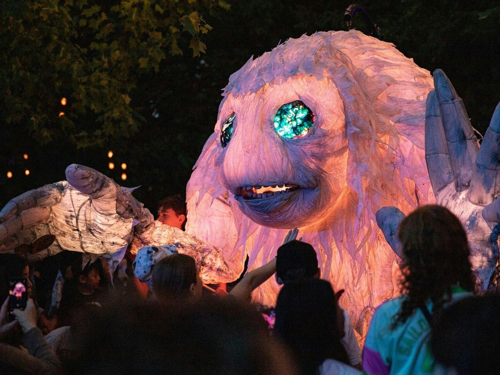 A whimsical monster featuring large eyes and an elongated nose, depicted in a playful pose.