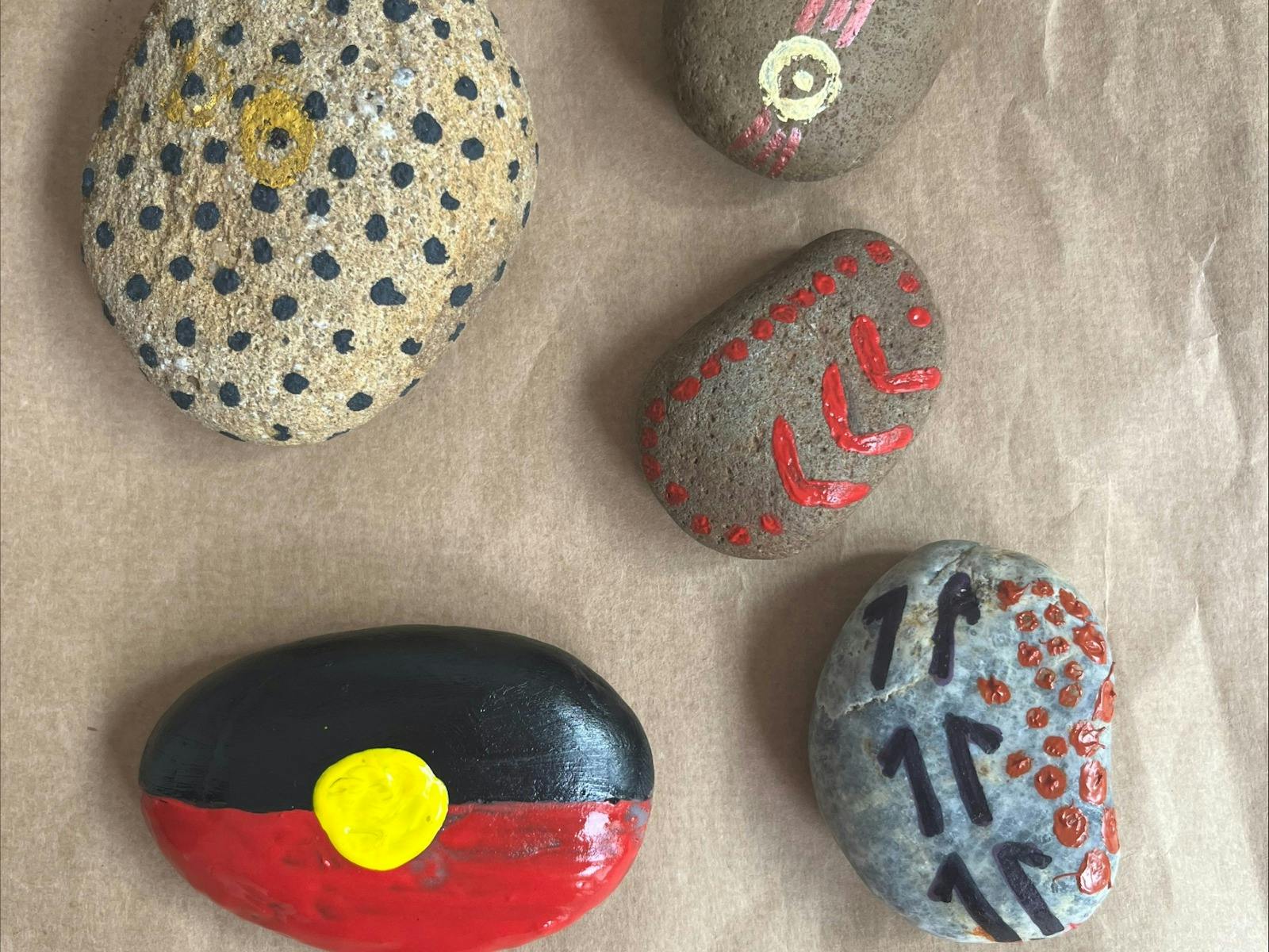 More stones with painted designs.
