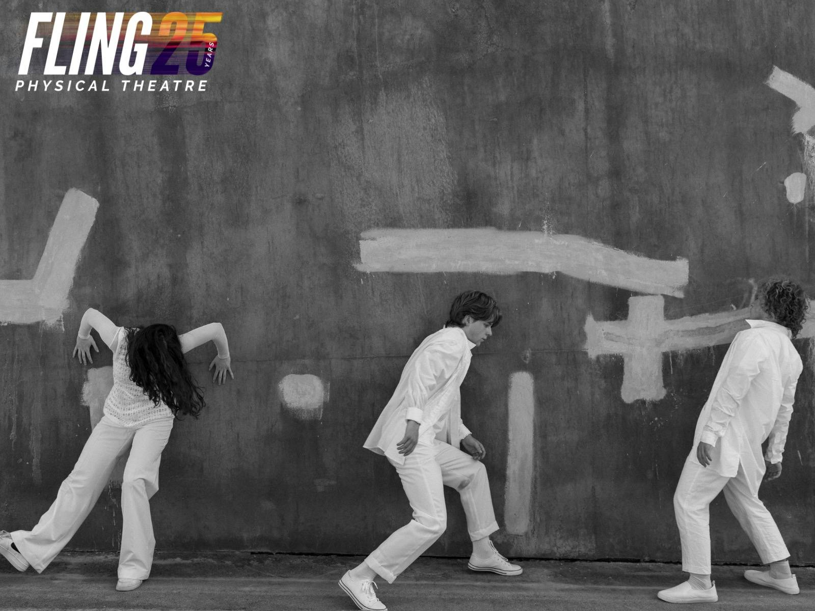 Three dancers all dressed in white clothing lean in geometric shapes against a wall plus FLING logo