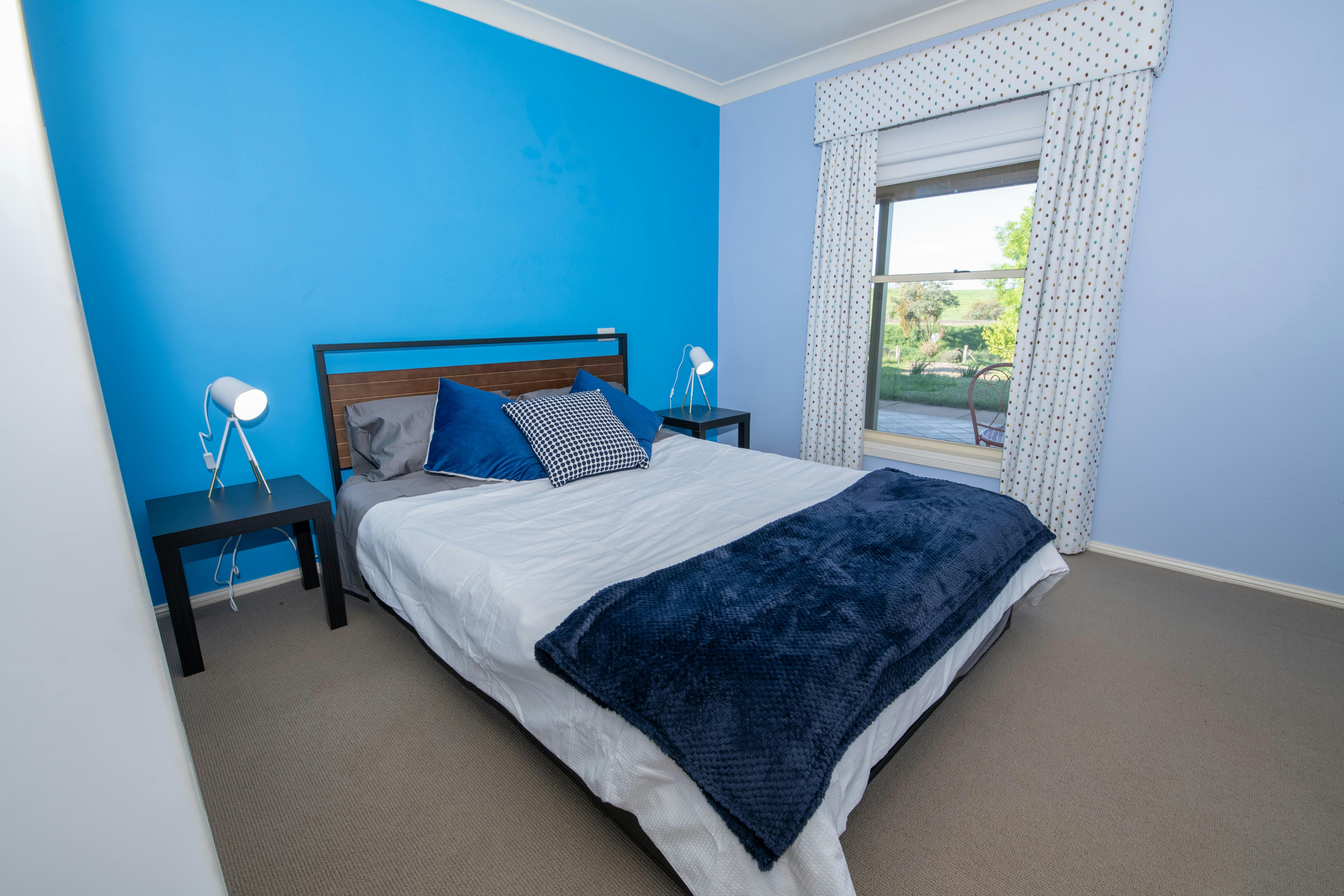 View of the second queen bedroom including the queen bed and views
