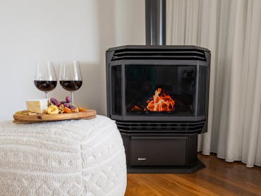 Gas fireplace, flames, cheese and wine platter