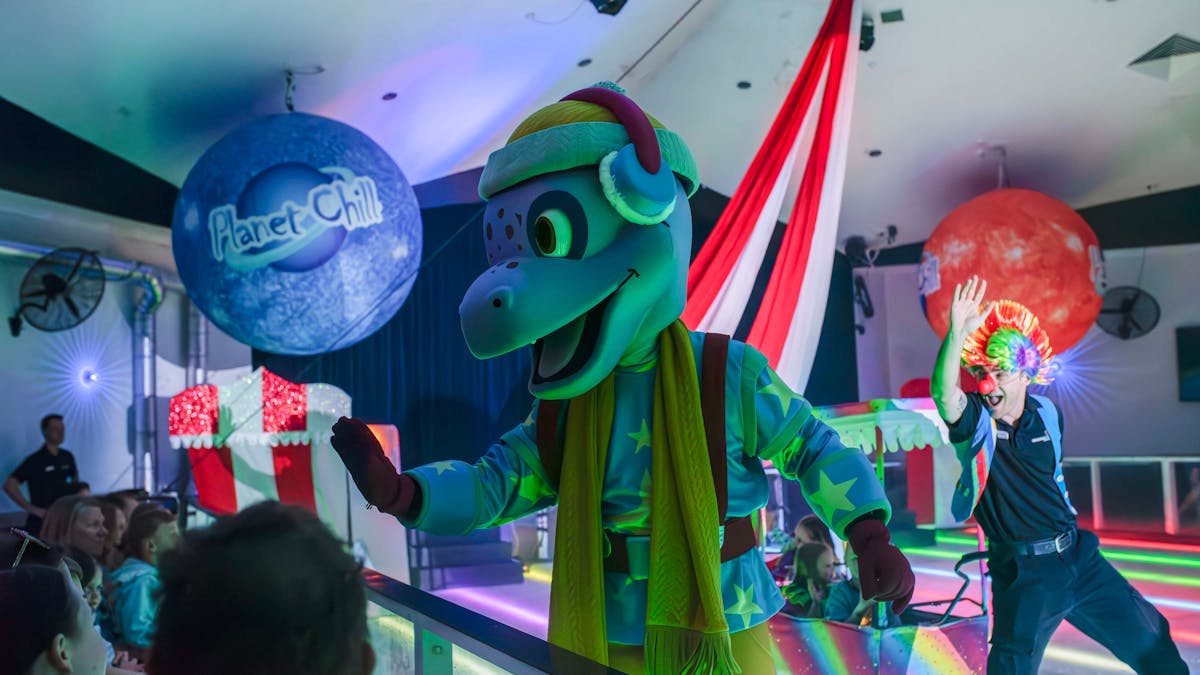 Astro, the resort mascot waving to the crowd Astro, the resort mascot waving to the crowd