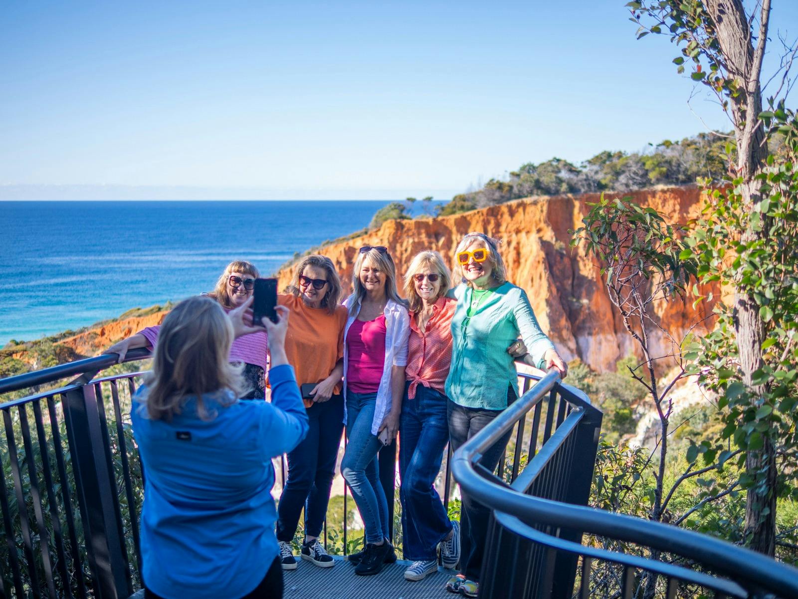 Guide photographing guests at The Pinnacles near Eden.