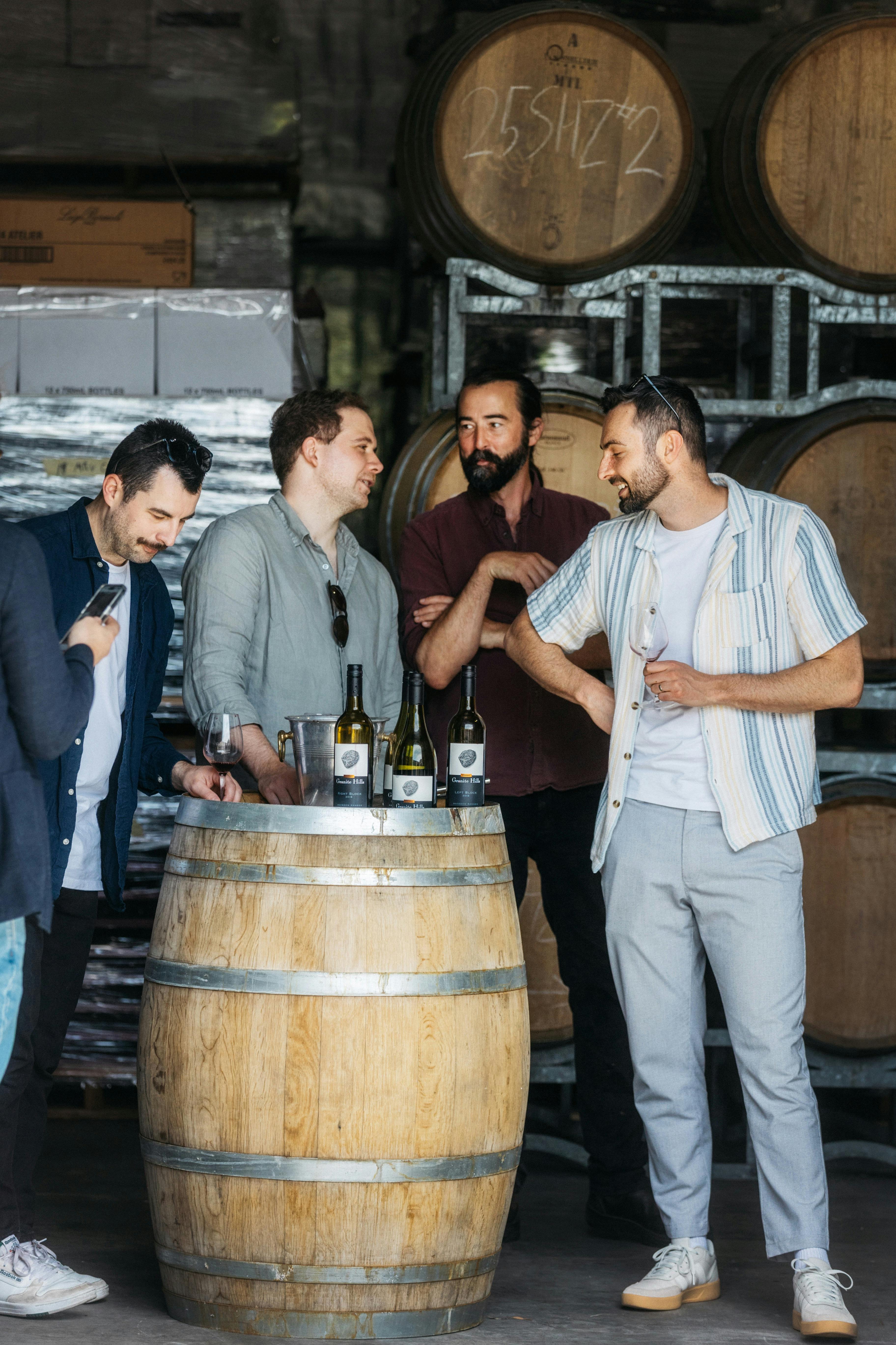Males enjoying wine tasting at Granite Hills