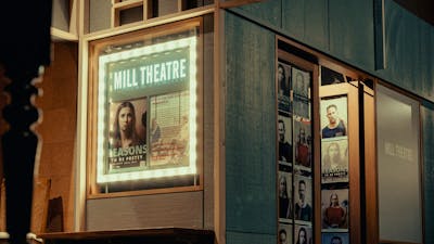 Outside the Mill Theatre, lightbox and doorway