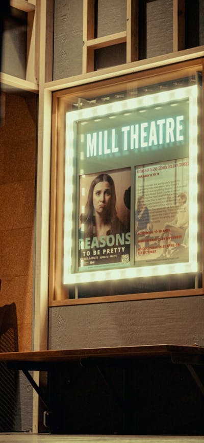 Outside the Mill Theatre, lightbox and doorway