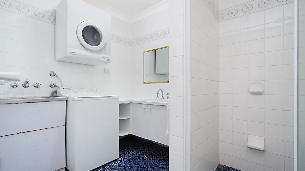 Bathroom with washing machine Bathroom with washing machine